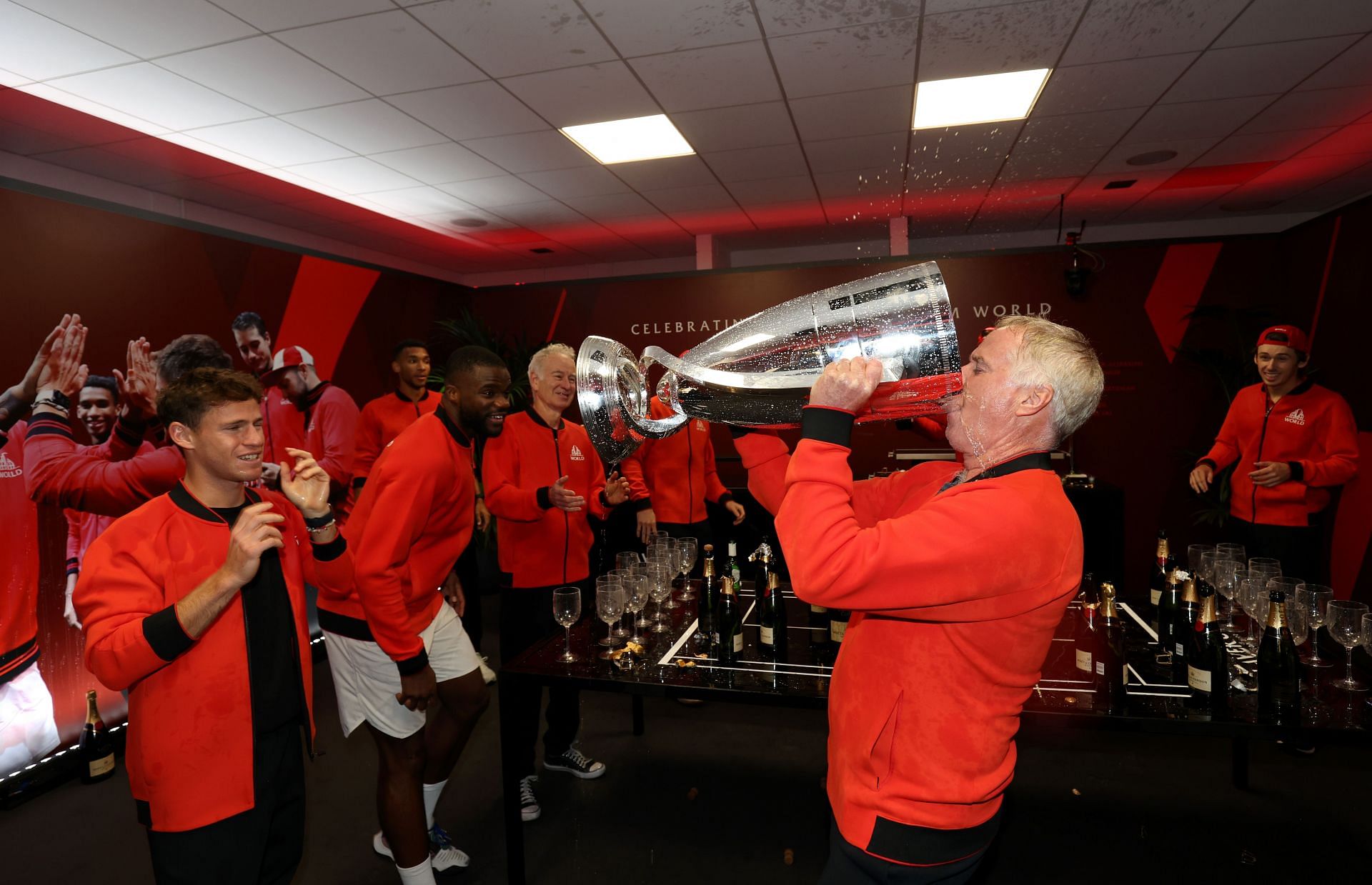 Patrick McEnroe, Vice Captain of Team World, drinks out of the Laver Cup trophy