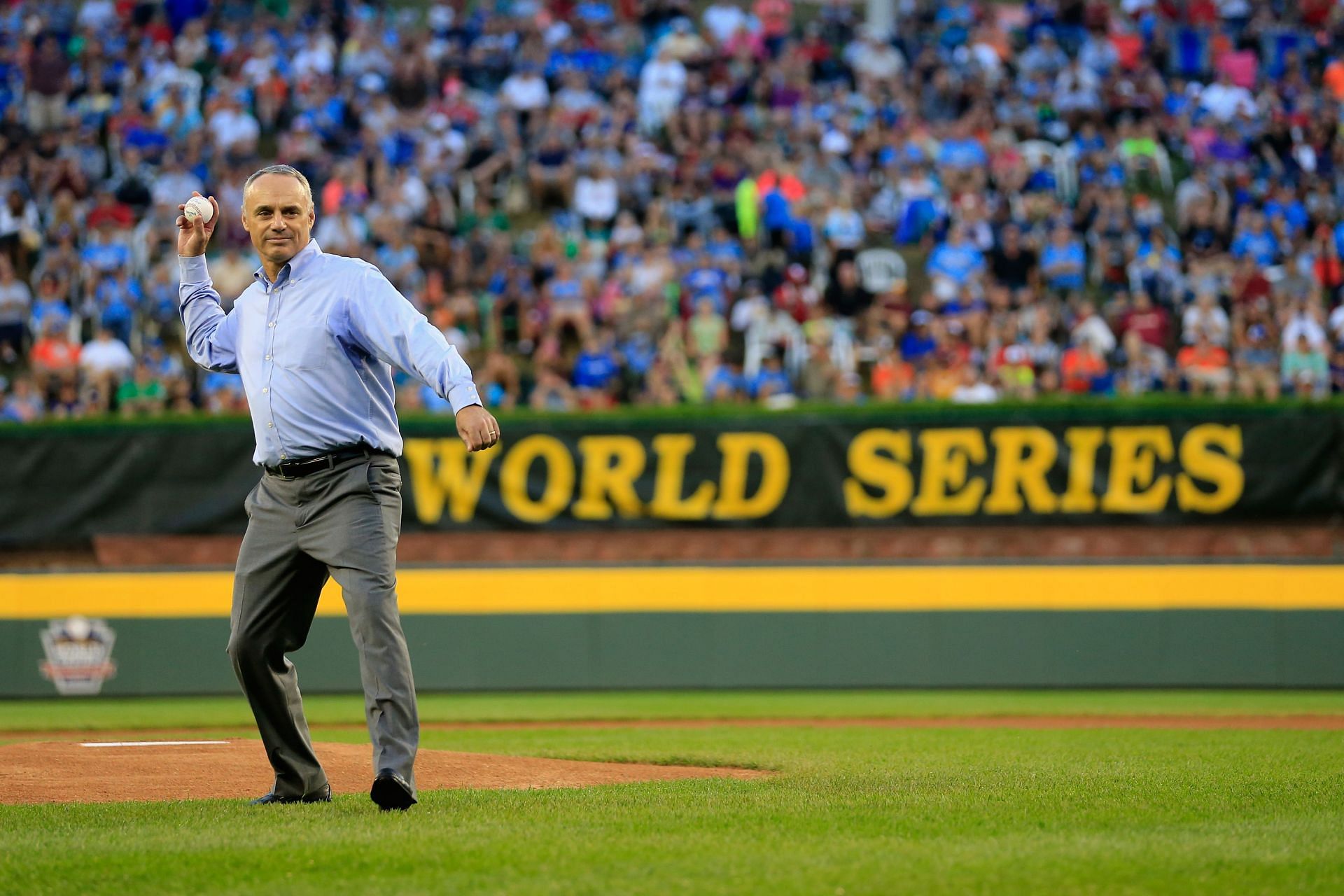 Major League Baseball COO and newly elected Commissioner of Major League Baseball Rob Manfred throws out the ceremonial first pitch before the start of the United States division game at the Little League World Series tournament at Lamade Stadium on Aug. 20, 2014 in South Williamsport, Pennsylvania.