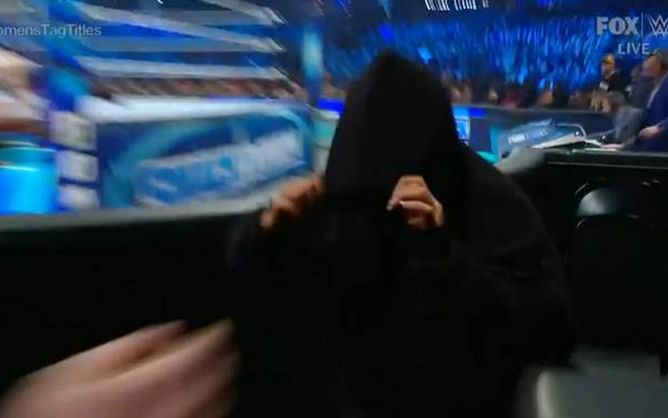 Watch: Mysterious attacker escorted out of WWE SmackDown by security