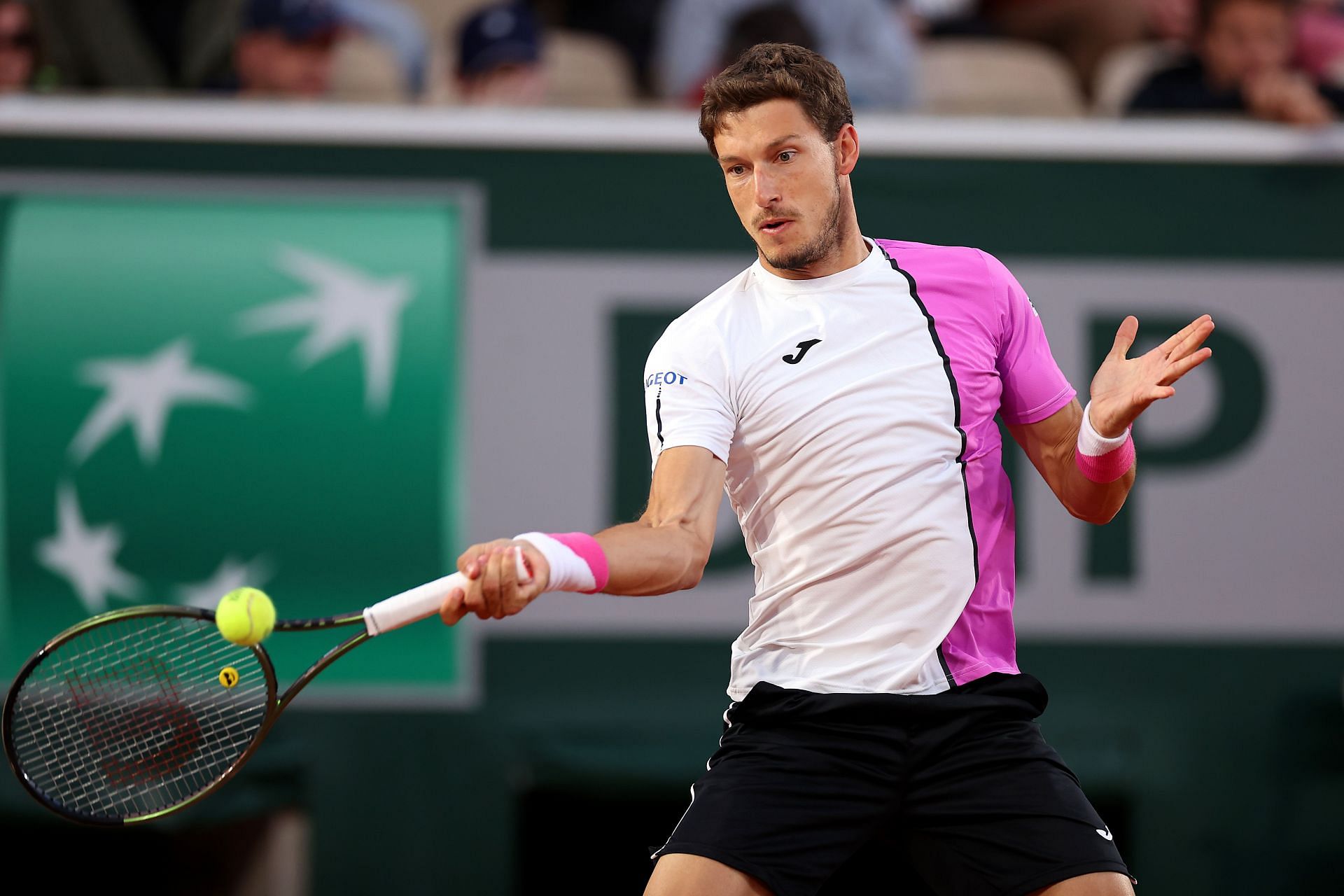Pablo Carreno Busta plays a forehand against Gilles Simon at the 2022 French Open