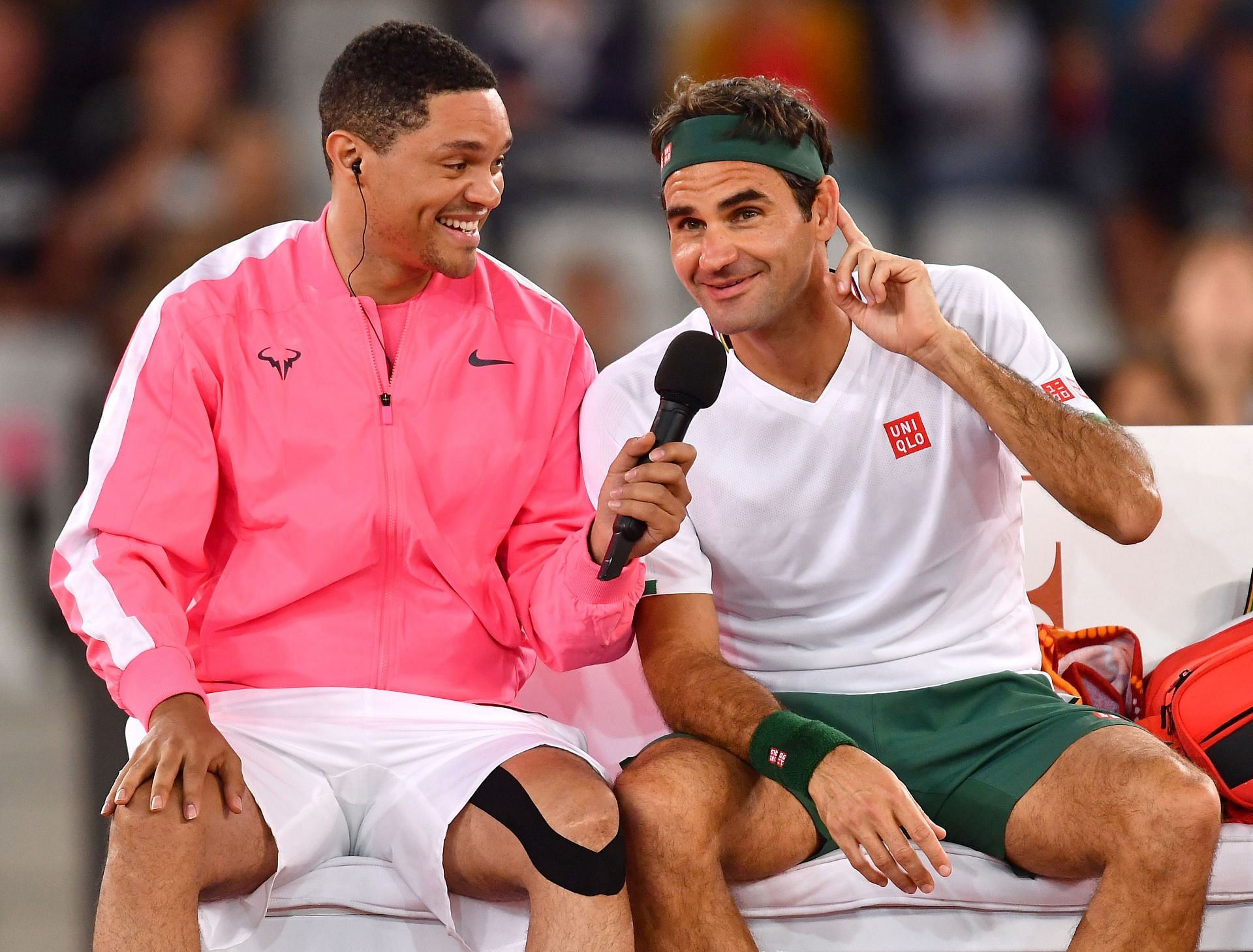Trevor Noah (L) and Roger Federer during an exhibition event in Cape Town.