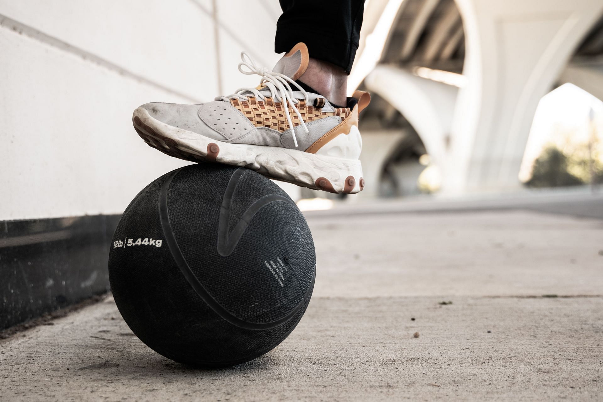 Medicine ball exercises can help you to strengthen your arms and shoulders. (Image via Unsplash / Brendan Stephens)