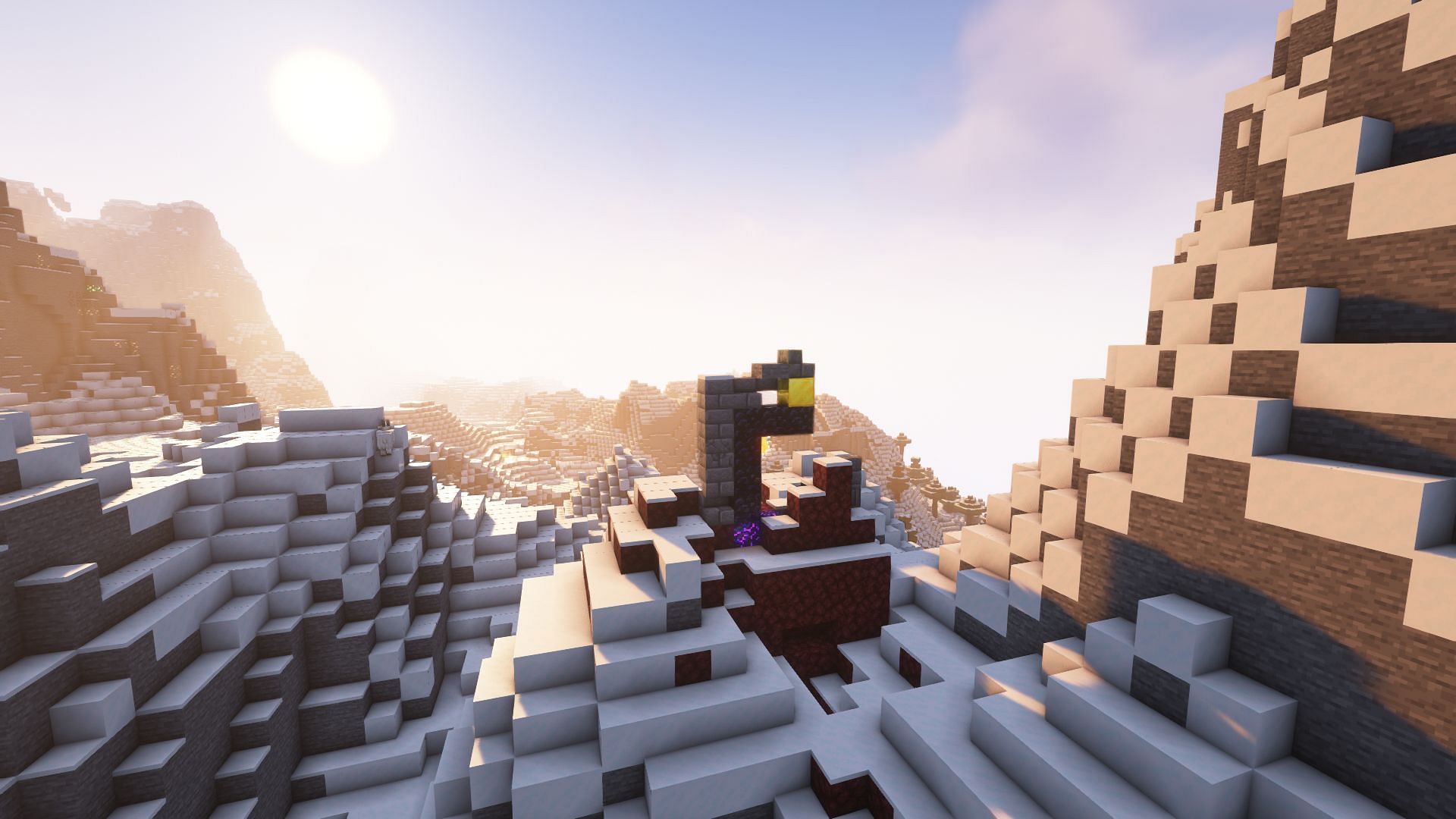 A ruined portal in the mountains (Image via Mojang)