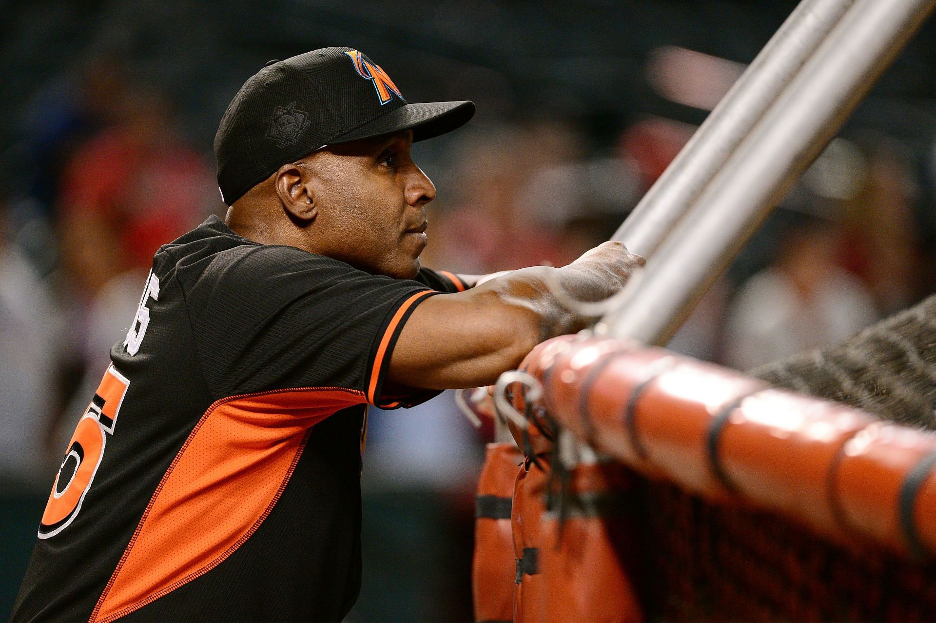 Barry Bonds #25 of the Miami Marlins watches batting practice prior to the MLB game