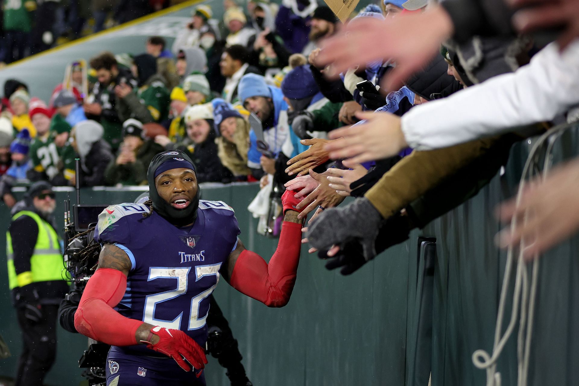 Derrick Henry of the Tennessee Titans celebrates with fans