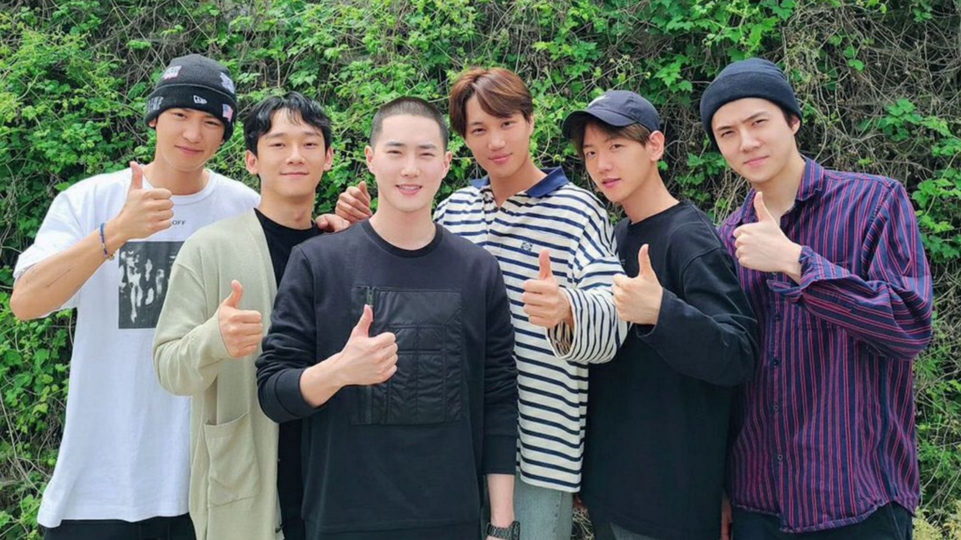 EXO members sent off their leader Suho (center in black) to the military on May 14, 2020. He returned in February, 2022. (Image via twitter/@kyungsoouldier)