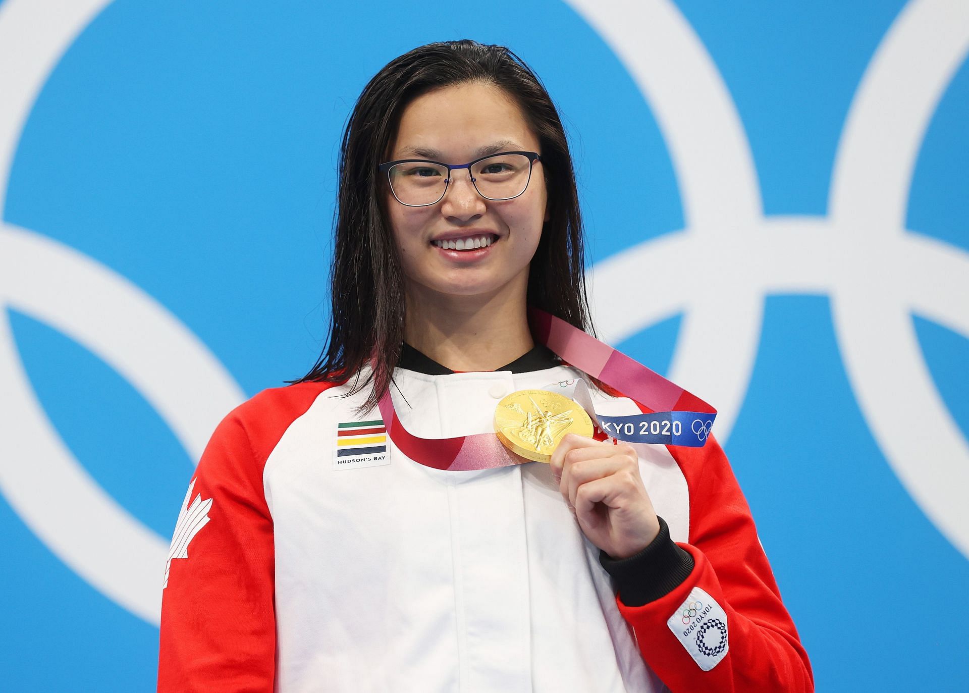 Margaret Macneil of Team Canada poses with the gold medal for the Women&#039;s 100m Butterfly Final on day three of the Tokyo 2020 Olympic Games.