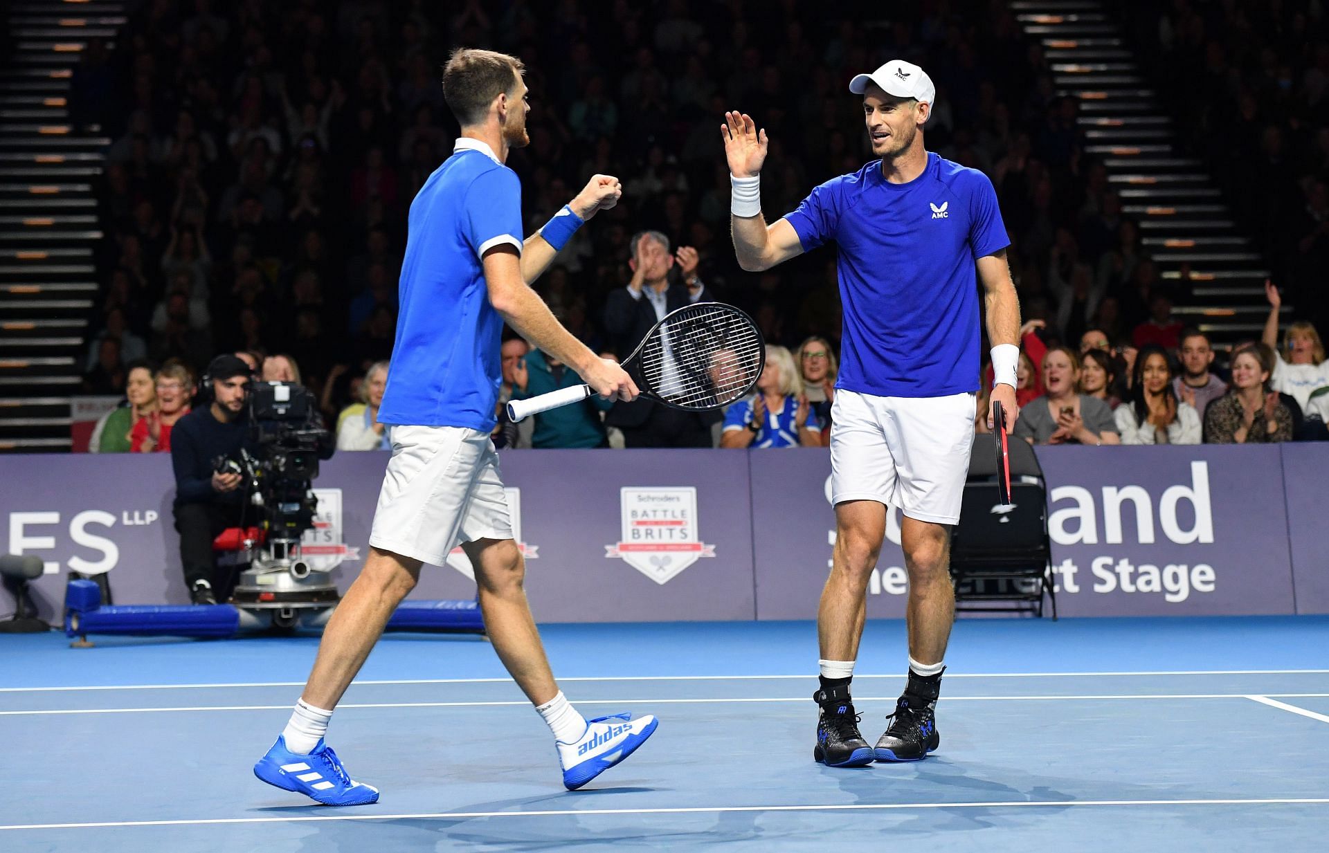 Andy Murray and Jamie Murray during their doubles match at Battle of the Brits.