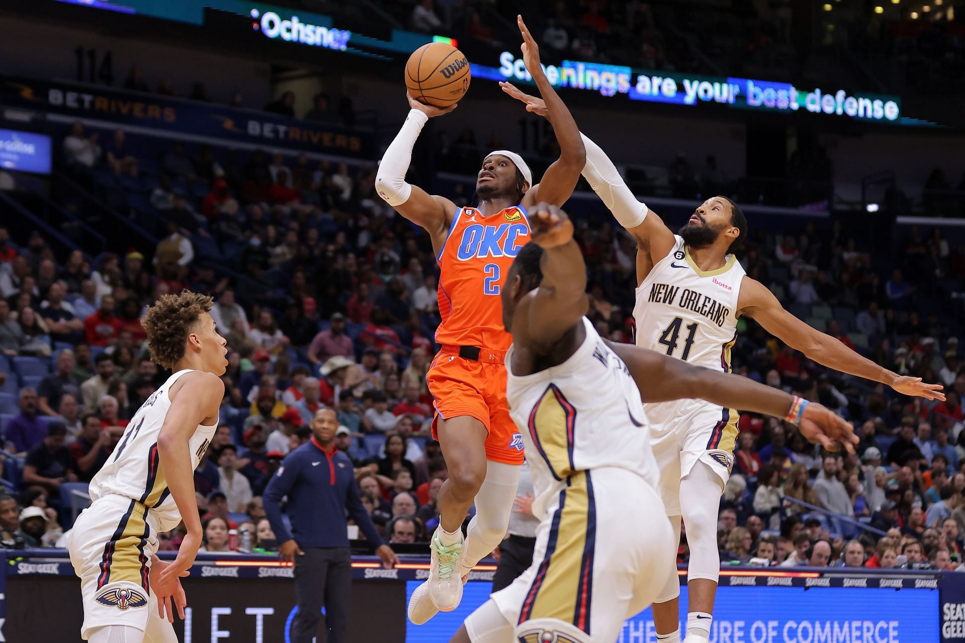 Shai Gilgeous-Alexander of the OKC Thunder shoots as Garrett Temple of the New Orleans Pelicans defends.