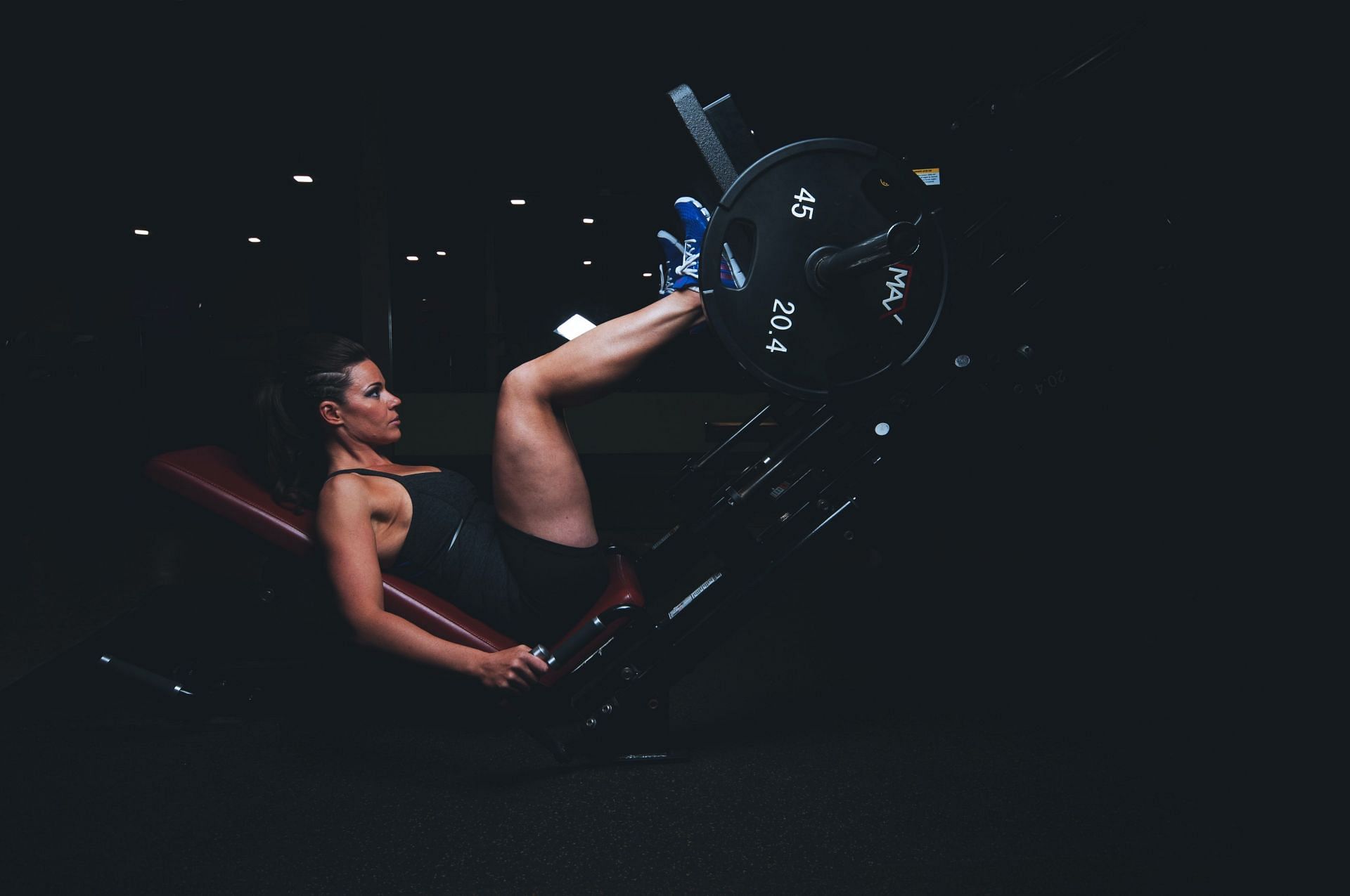 Leg exercise machines for your workout routine. (Image via Unsplash/Scott Webb)