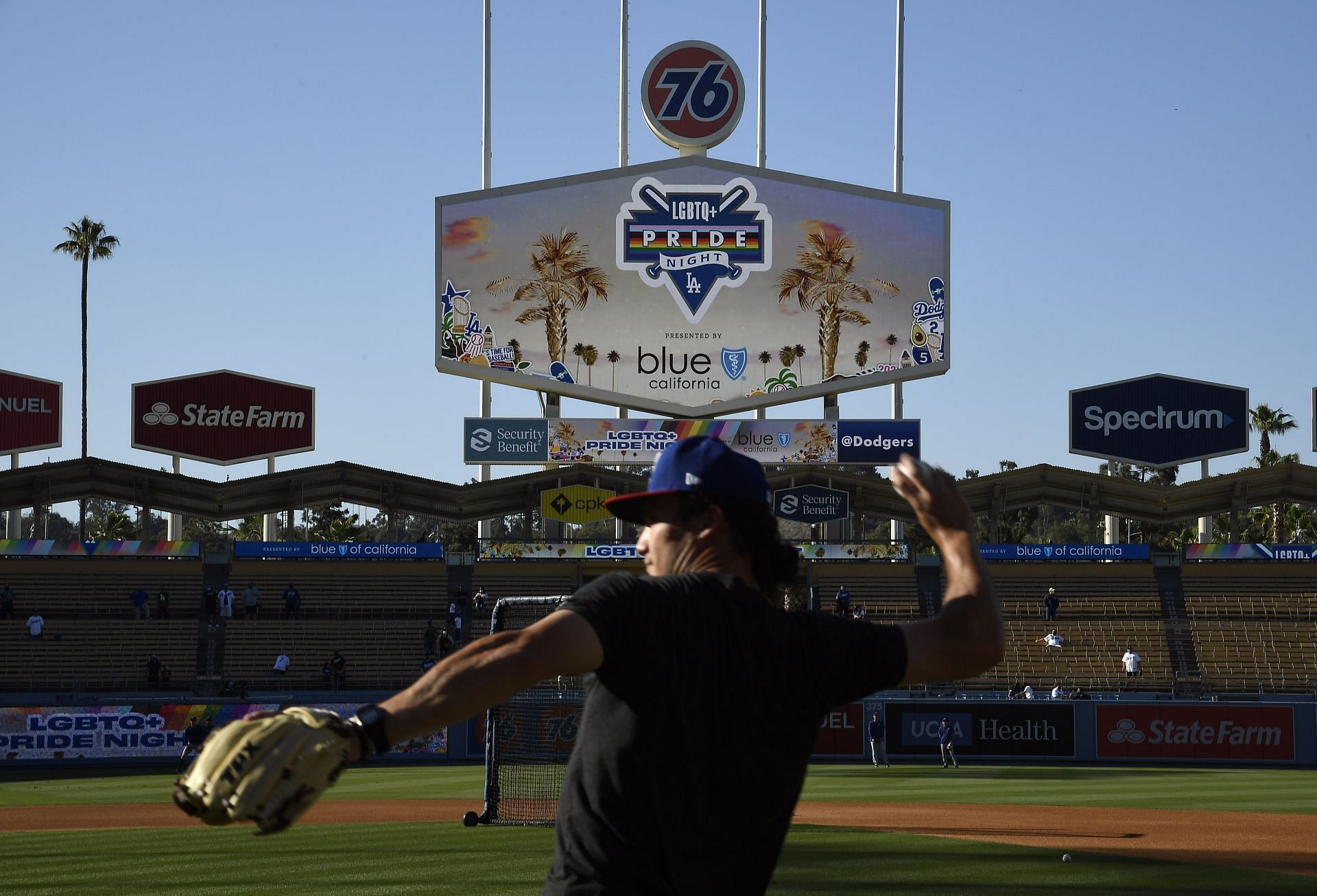 Coach Alex Burg of the Texas Rangers throws the baseball during the eighth annual LGBTQ+ Night (Photo by Kevork Djansezian/Getty Images)