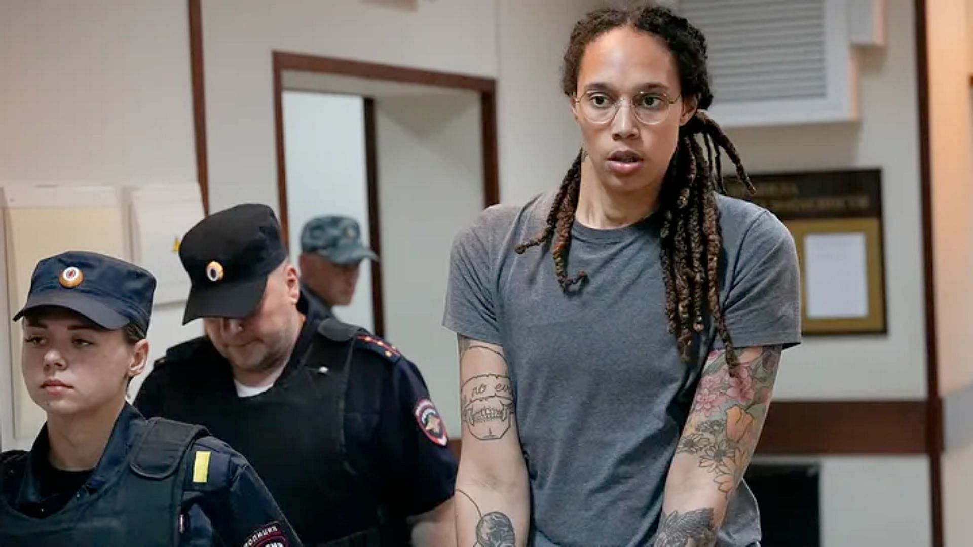 Brittney Griner being escorted after a hearing outside Moscow,. (image via Alexander Zemlianichenko)