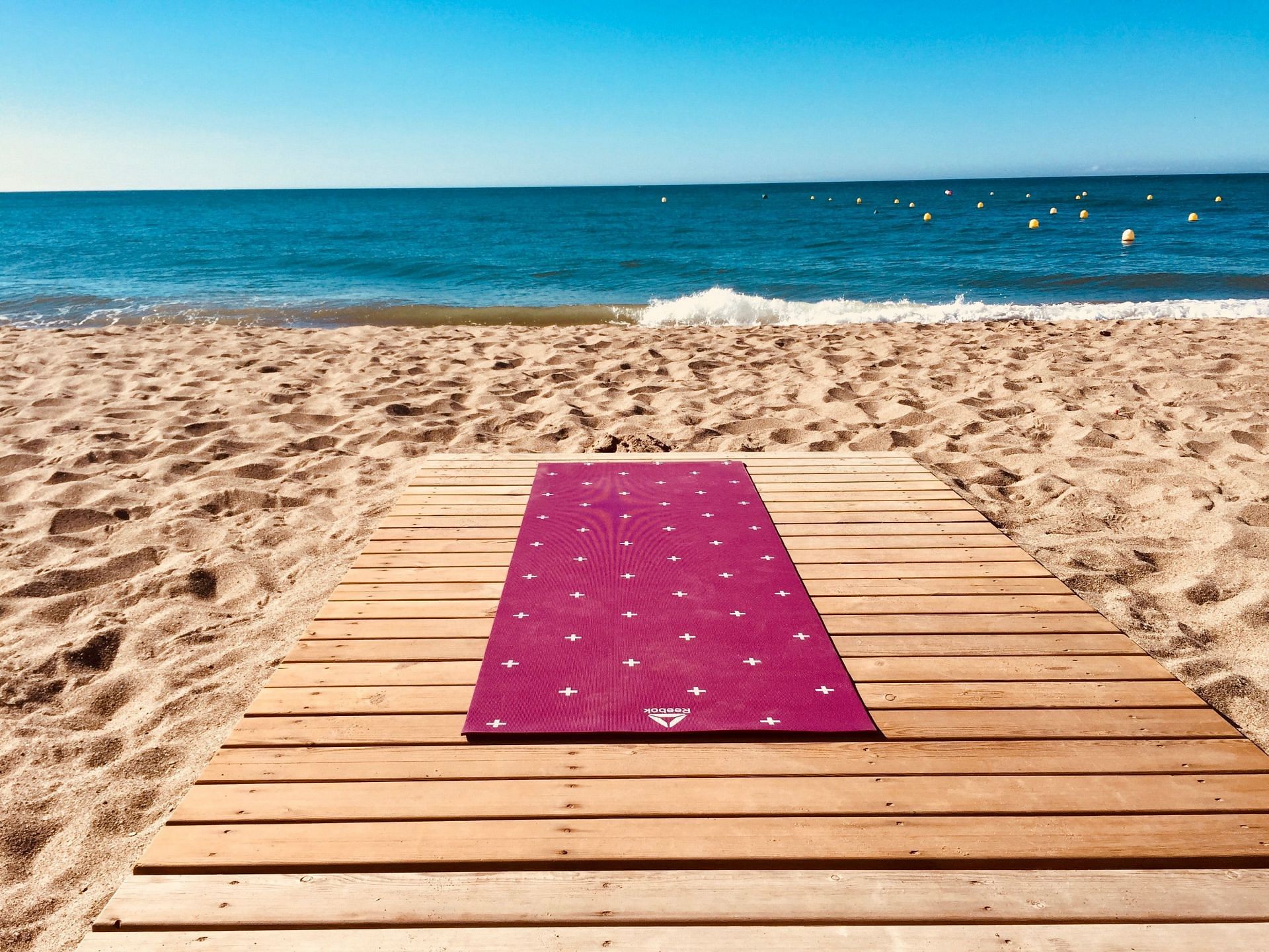 Outdoor yoga sessions are better performed with yoga mats. (Image via Unsplash/ Valentina Sotnikova)