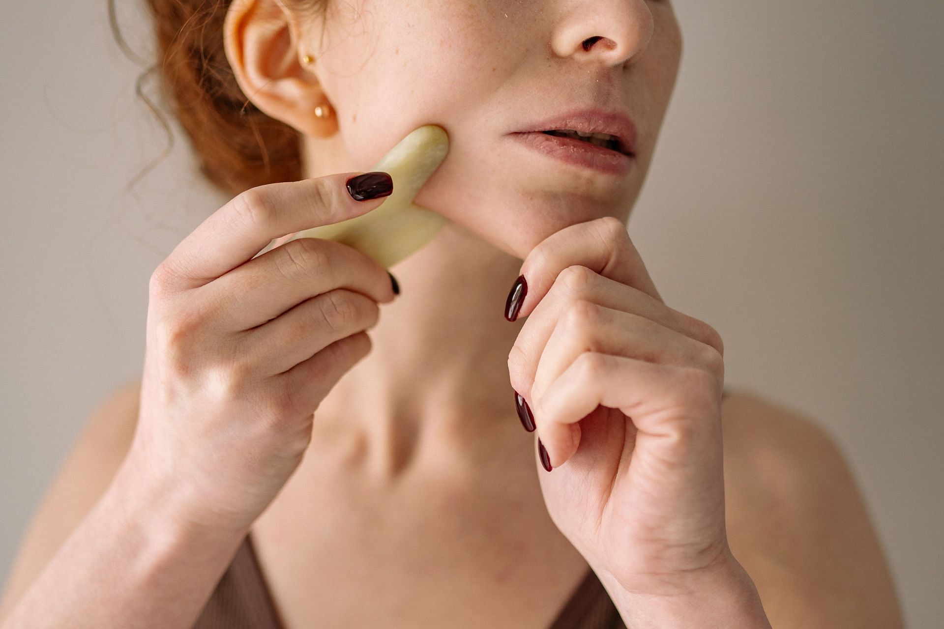 Gua Sha is a chinese facial scraping technique to reduce fine lines and wrinkles. (Image via Pexels / Yan Krukov)