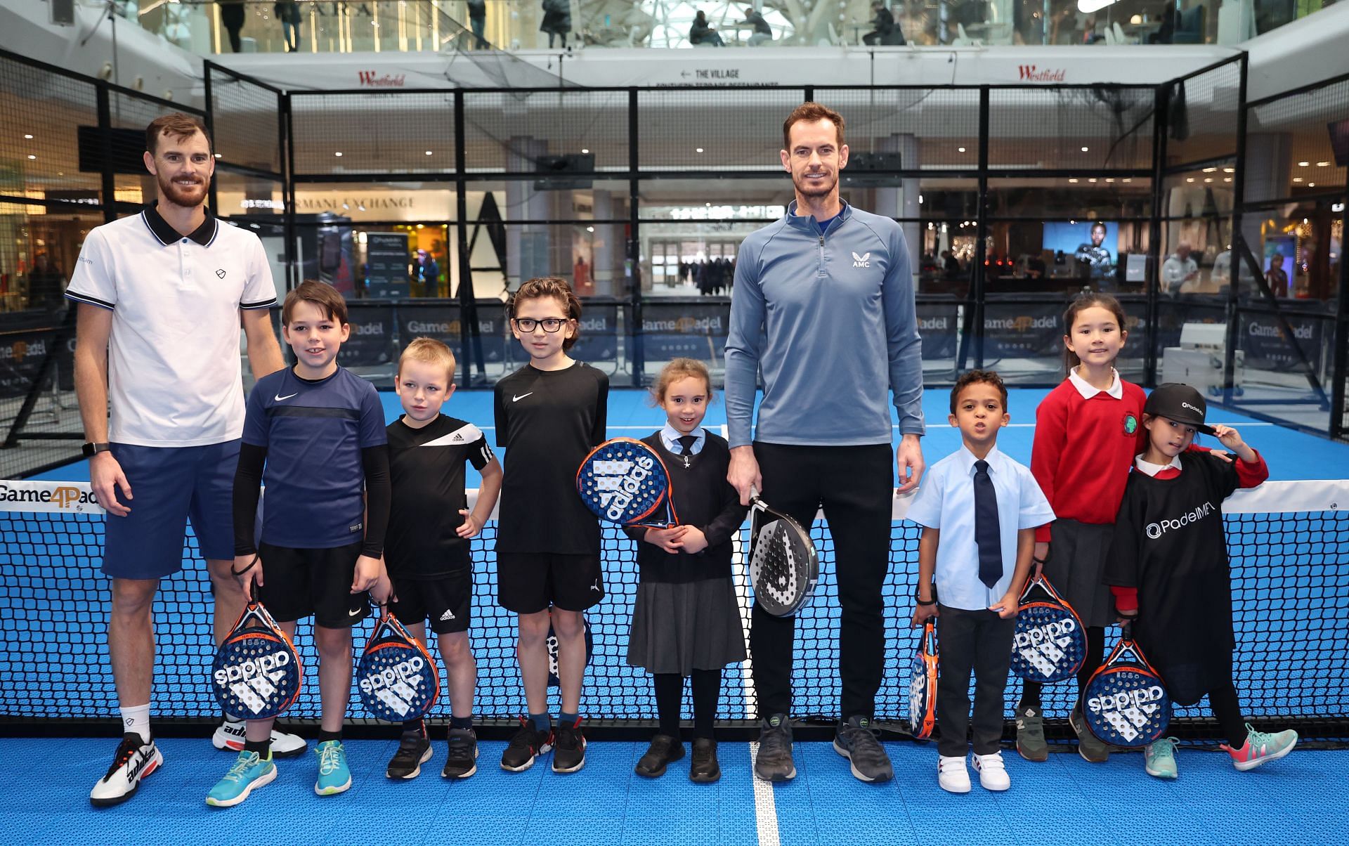 Andy Murray and Jamie Murray play Padel with local school children