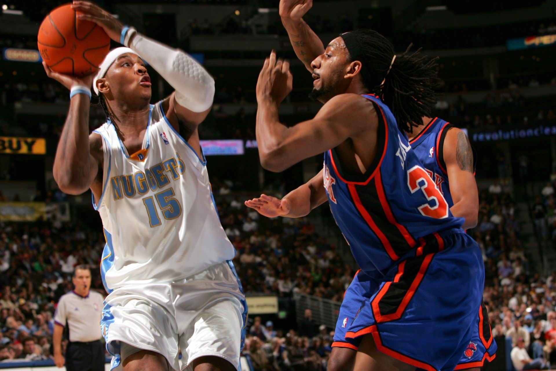 Carmelo Anthony of the Denver Nuggets is defended by Renaldo Balkman of the New York Knicks