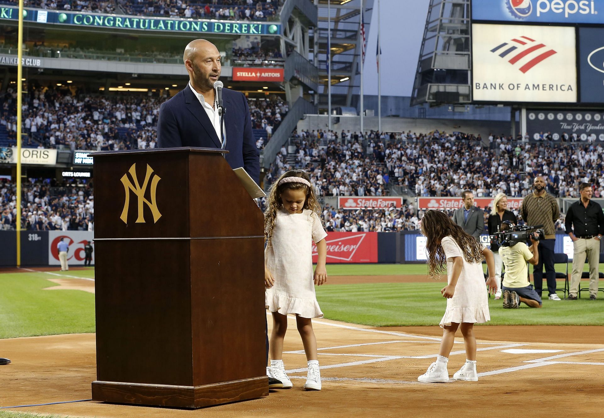 NEW YORK - SEPTEMBER 09: Baseball Hall of Famer Derek Jeter speaks to the fans alongside his daughters Bella(L) and Story as he is honored by the New York Yankees before a game against the Tampa Bay Rays at Yankee Stadium on September 09, 2022, in the Bronx borough of New York City. (Photo by Jim McIsaac/Getty Images)