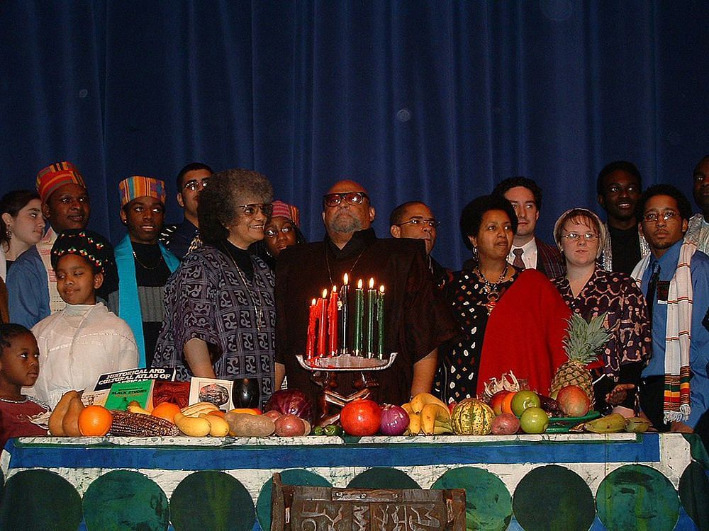 A celebration with Maulana Karenga at the center (Image via Wikimedia Commons)