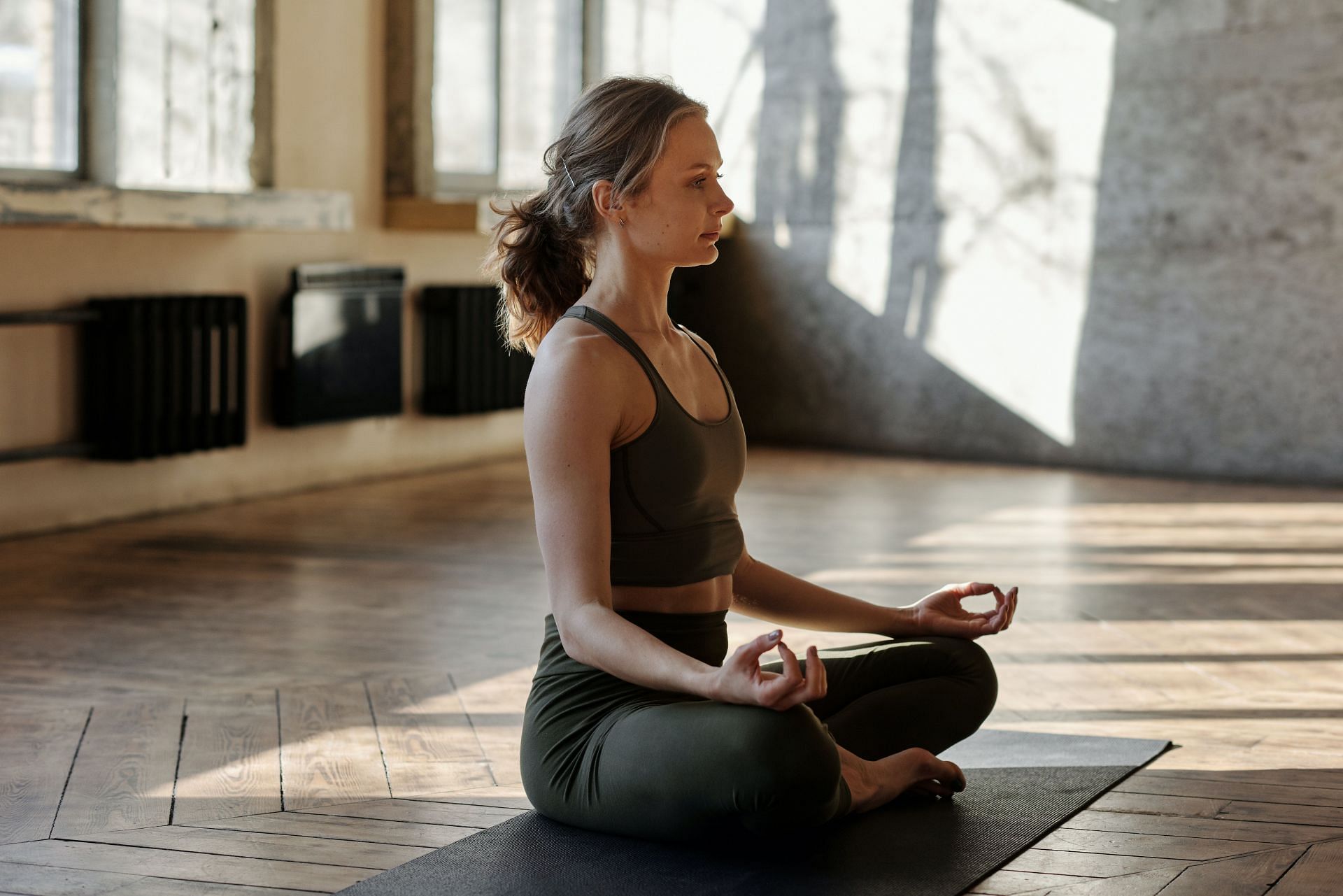 Meditation in yoga studio. (Image via Pexels/ Cliff Booth)