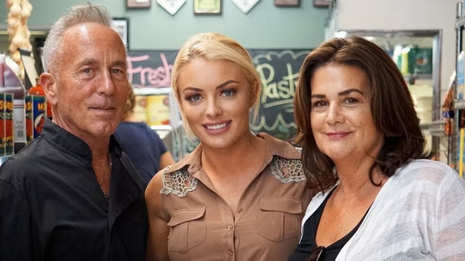 Mandy Rose with her parents