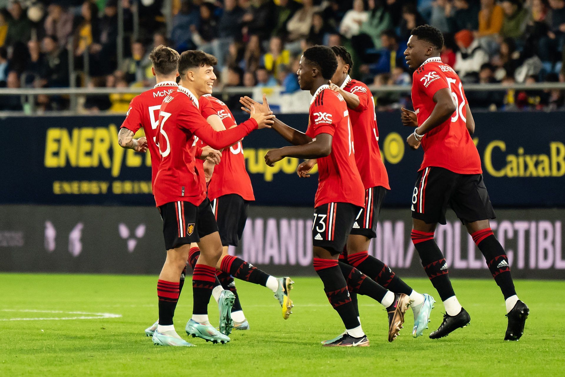 Kobbie Mainoo (center) celebrates after scoring a goal against Cadiz