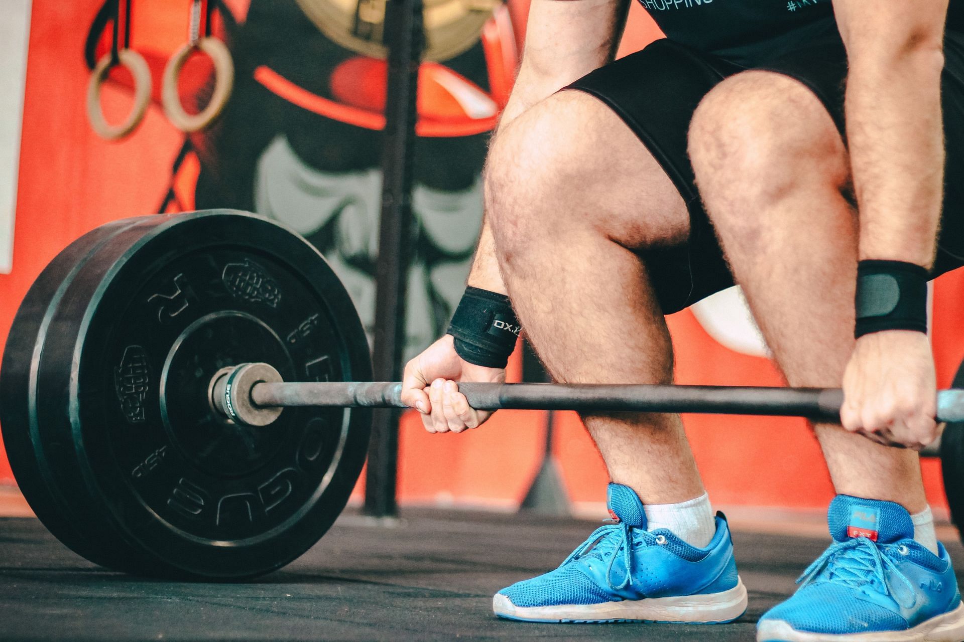 Deadlifts are compound leg exercises that work multiple muscle groups in your body (Photo by Unsplash/Victor Freitas)