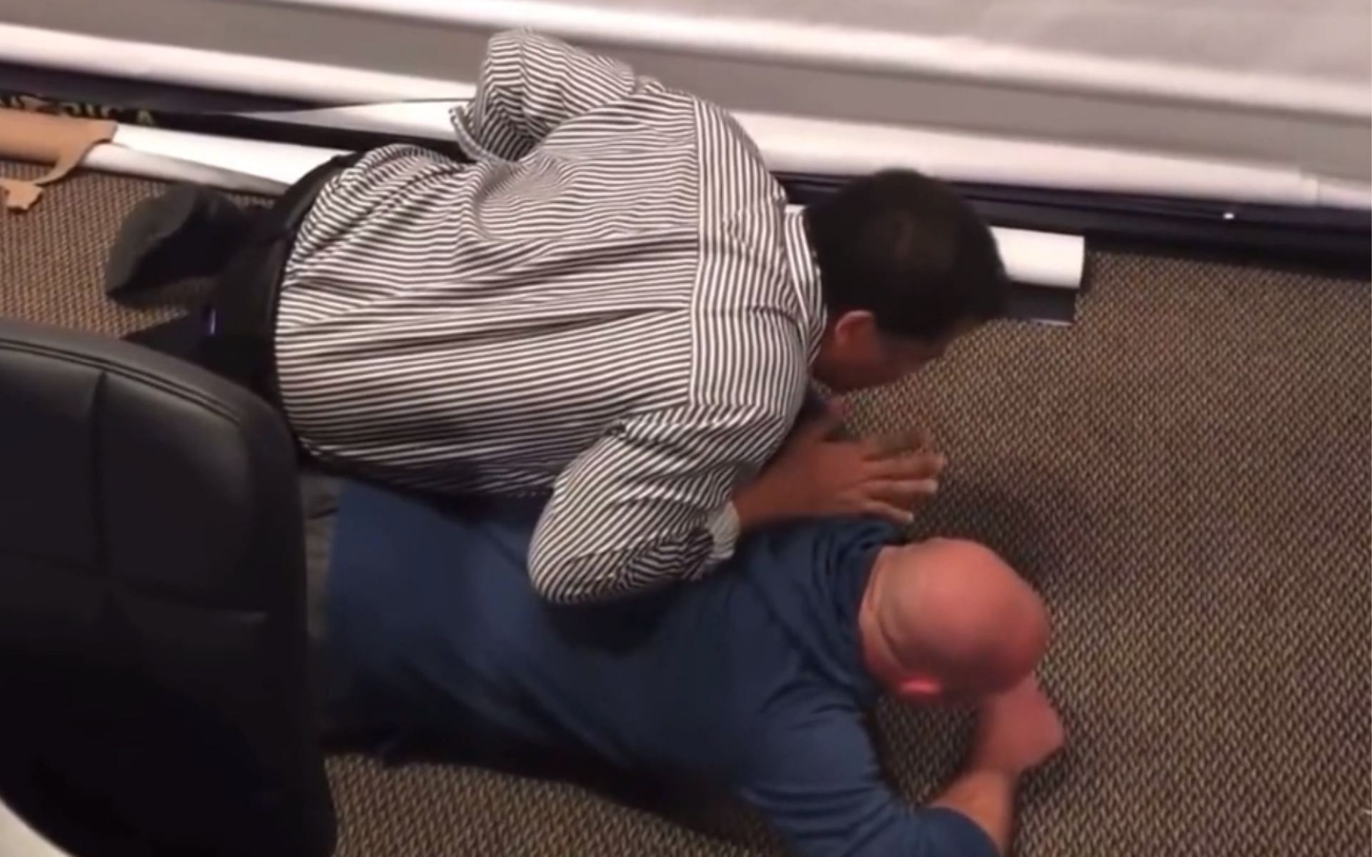Neil deGrasse Tyson demonstrating his pinning technique against Matt Serra [Image courtesy: @BlaineHenryTFL Twitter account via UFC Unfiltered podcast]