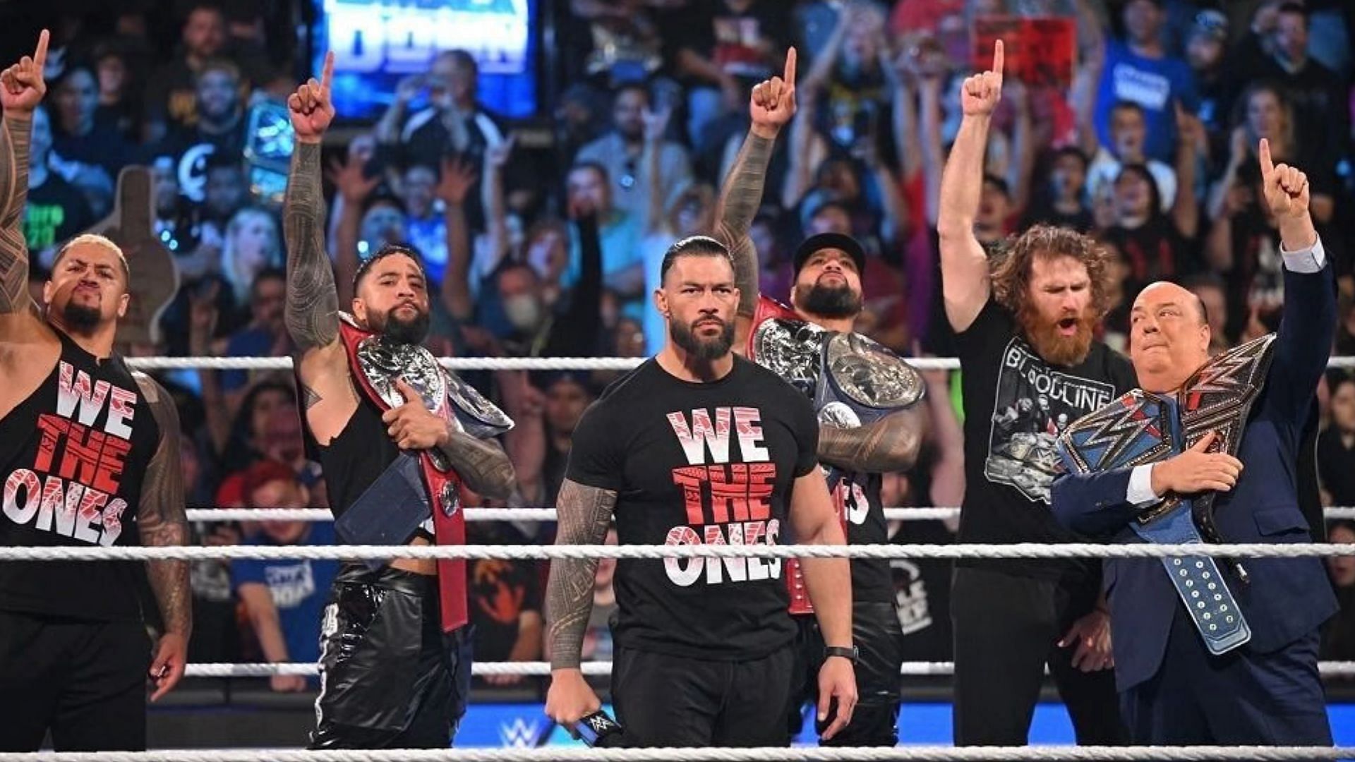 The Bloodline posing in the ring on WWE SmackDown
