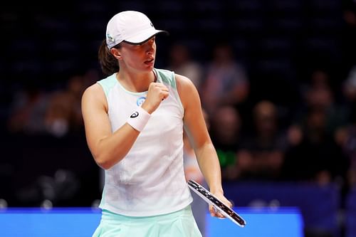 Iga Swiatek of Kites reacts while playing against Elena Rybakina of Hawks at the World Tennis League