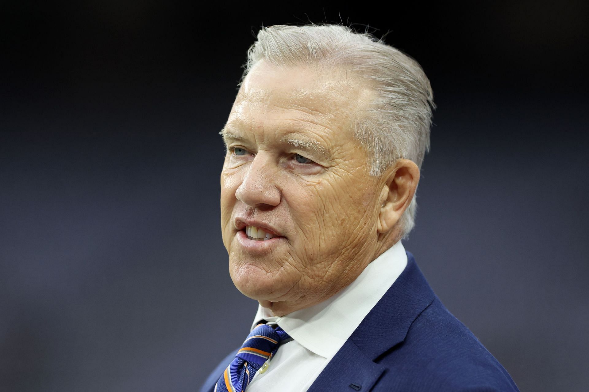 President of football operations John Elway of the Denver Broncos looks on during pre-game