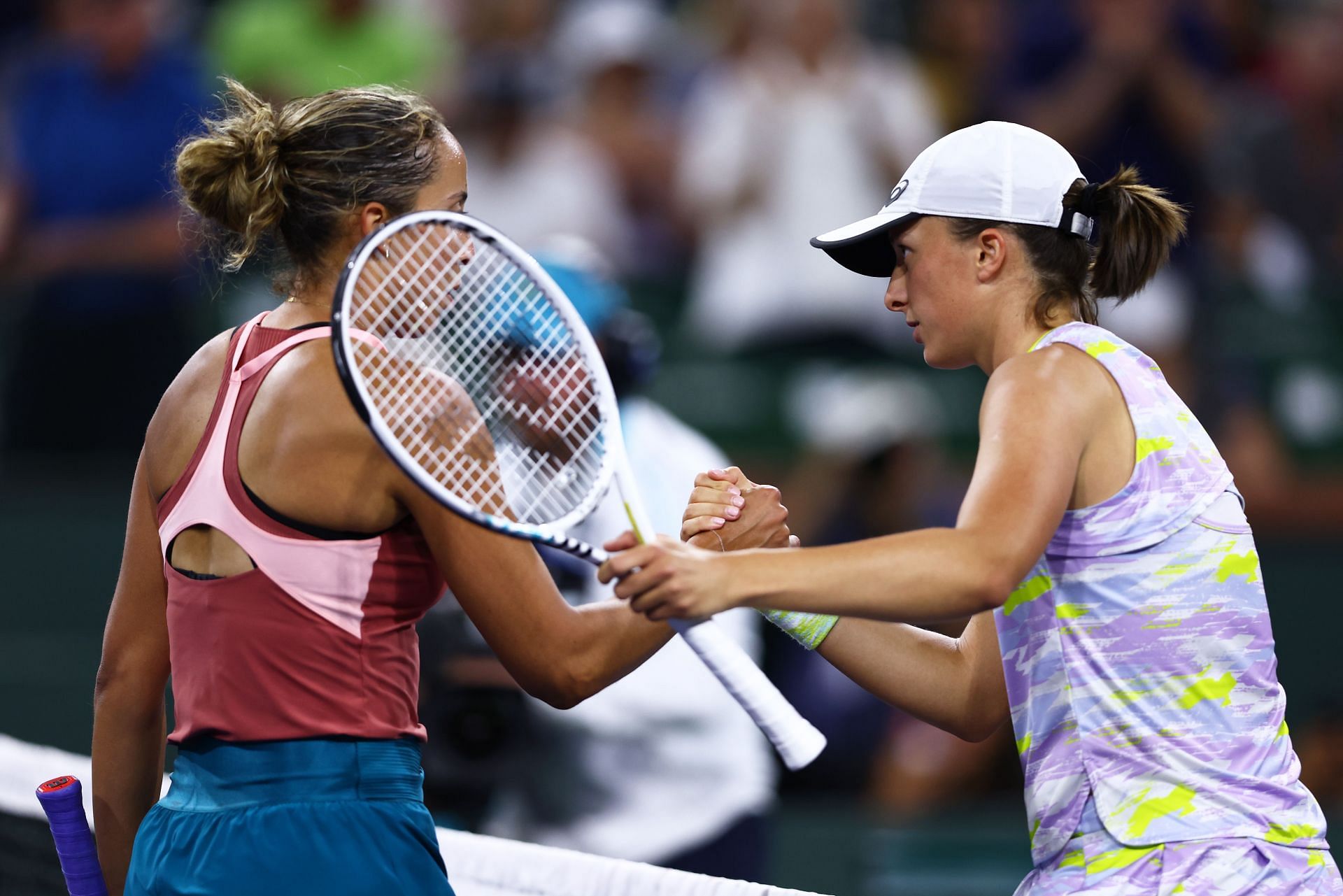 Iga Swiatek (R) shakes hands after her straight-sets victory over Madison Keys at the BNP Paribas Open