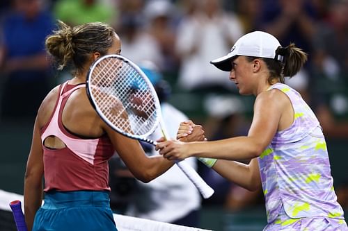 Iga Swiatek (R) shakes hands after her straight-sets victory over Madison Keys at the BNP Paribas Open