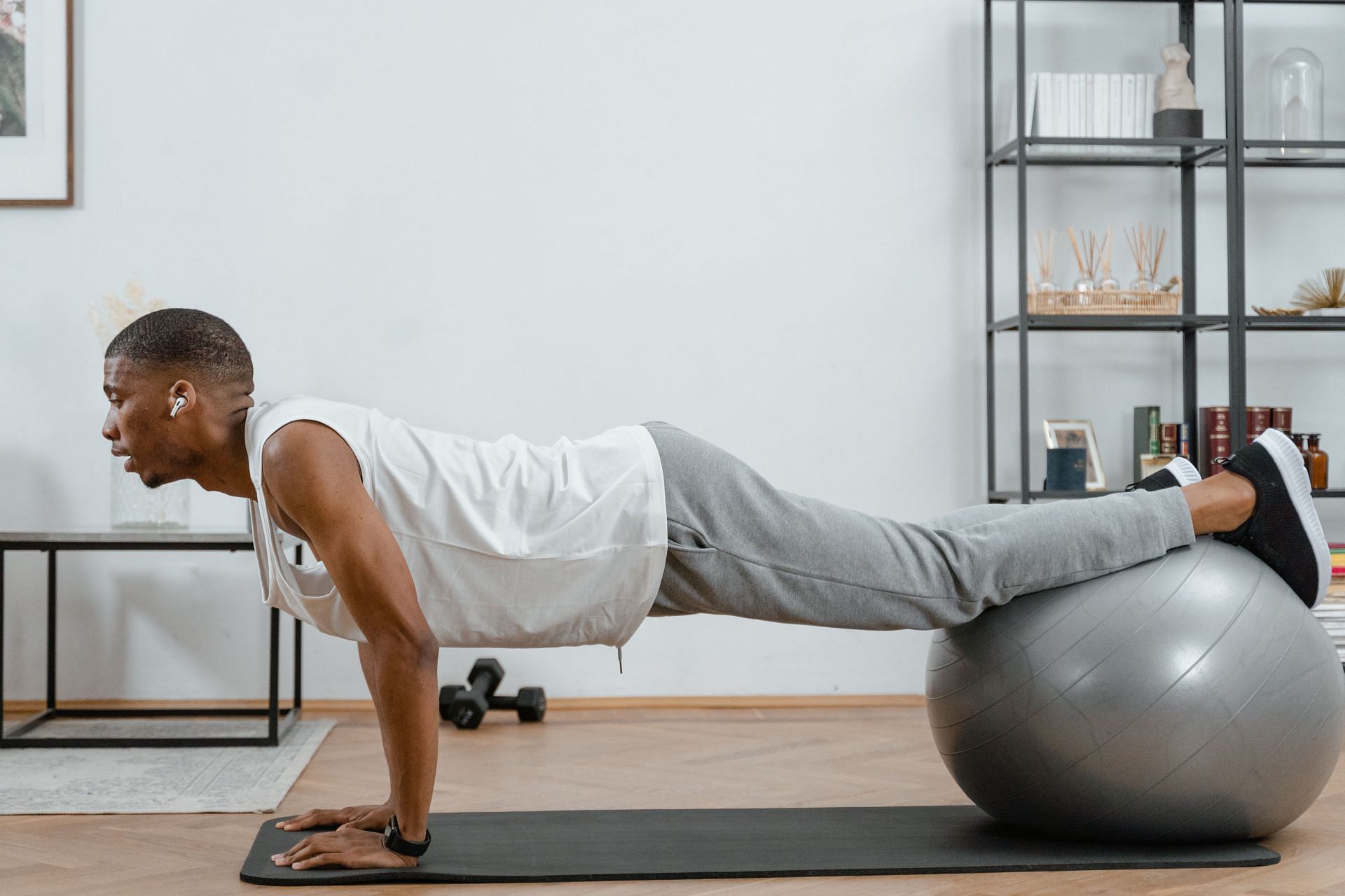 Yoga ball plank is a very good workout for your core (Image via Pexels@Mart Production)