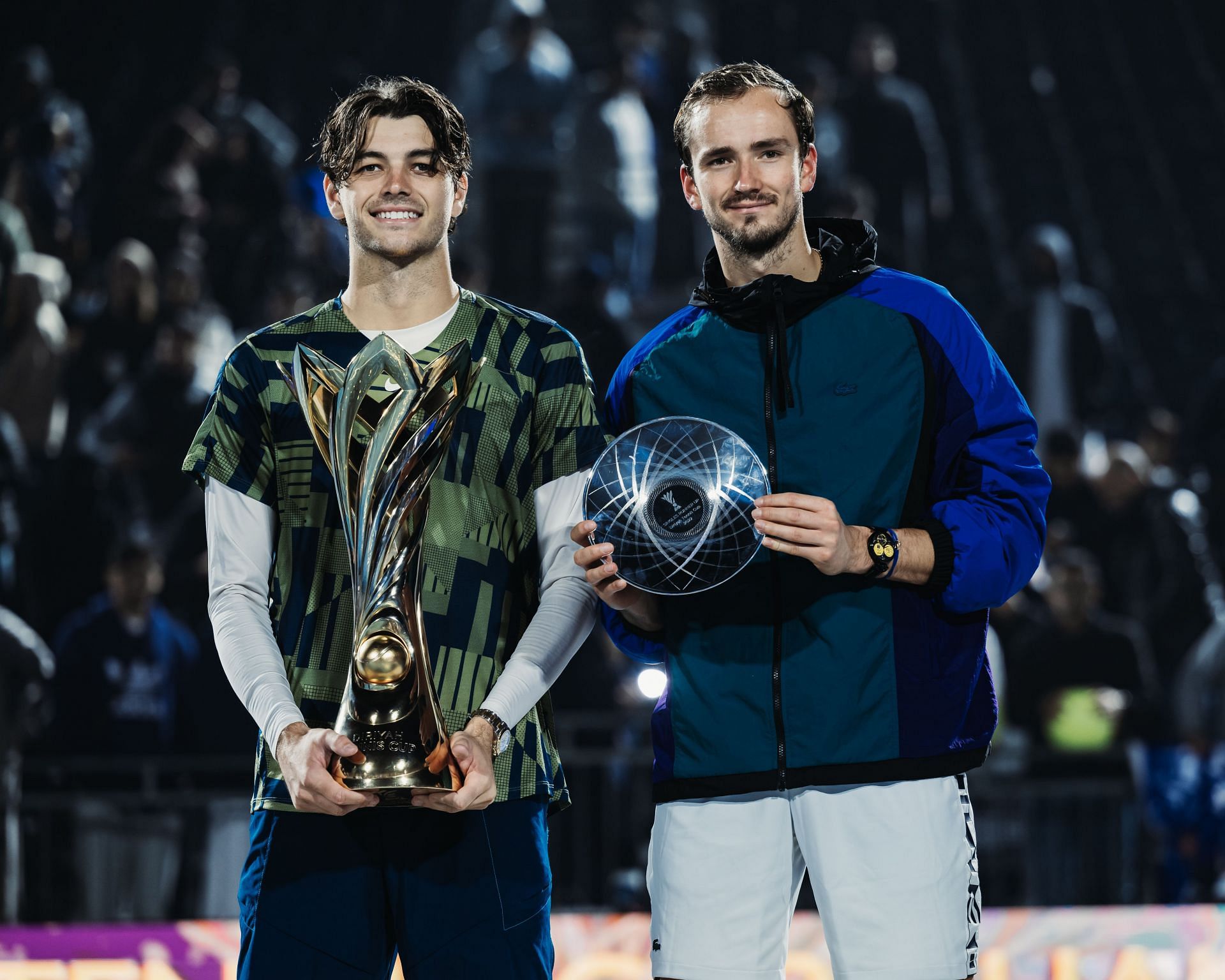 Taylor Fritz (L) and Daniil Medvedev with their trophies at the Diriyah Tennis Cup Riyadh 2022.