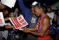 Jackie Joyner-Kersee and husband Bob Kersee signing autographs, 1998