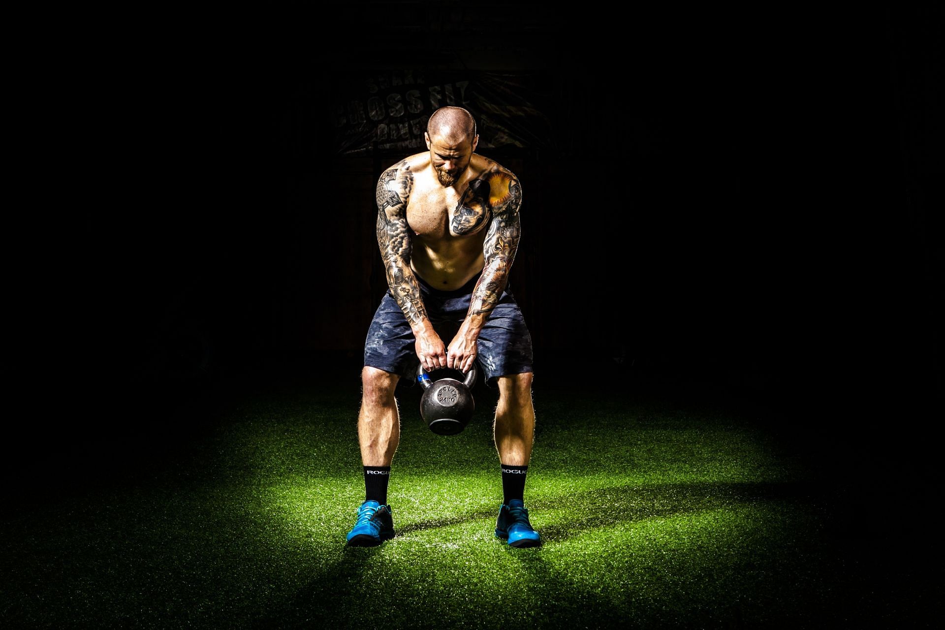 Kettlebell swings (Image via Pexels/Binyamin Mellish)