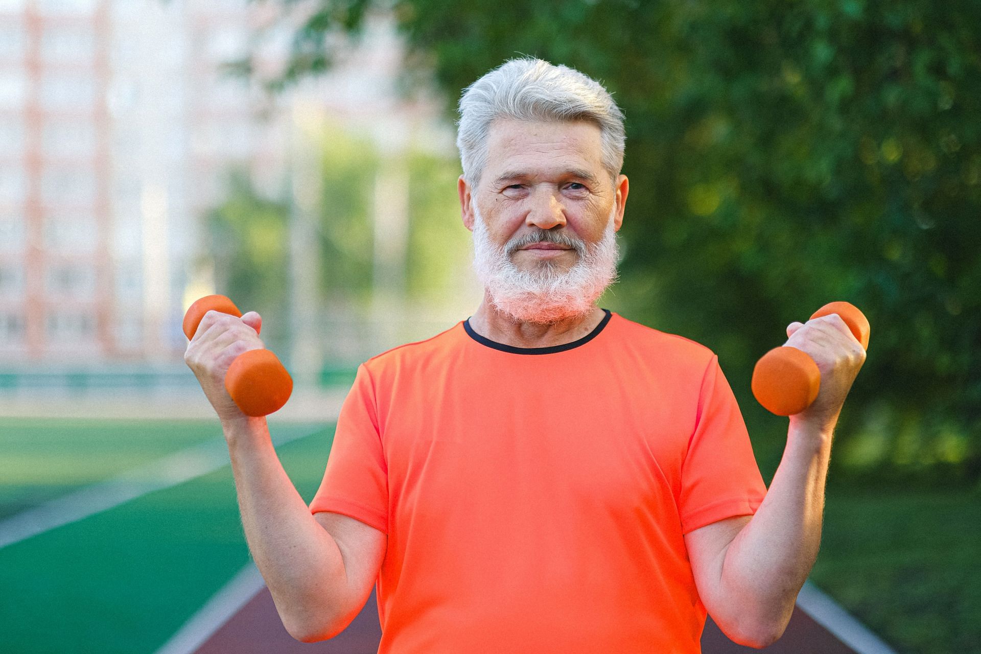 At-home dumbbell exercises are a simple and convenient way for seniors to build muscle (Image via Pexels @Anna Shvets)