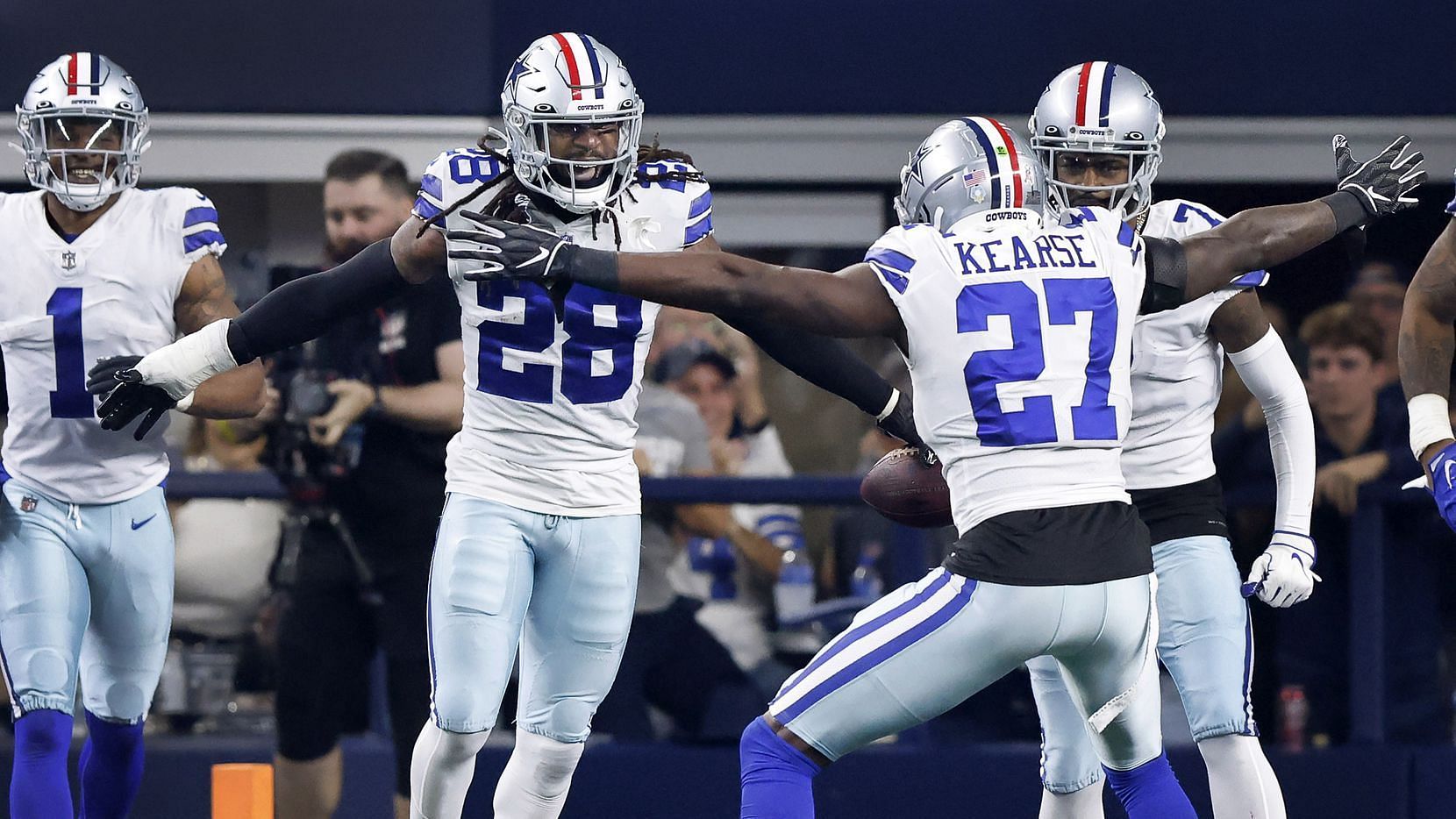 Cowboys wearing helmets with special red stripe