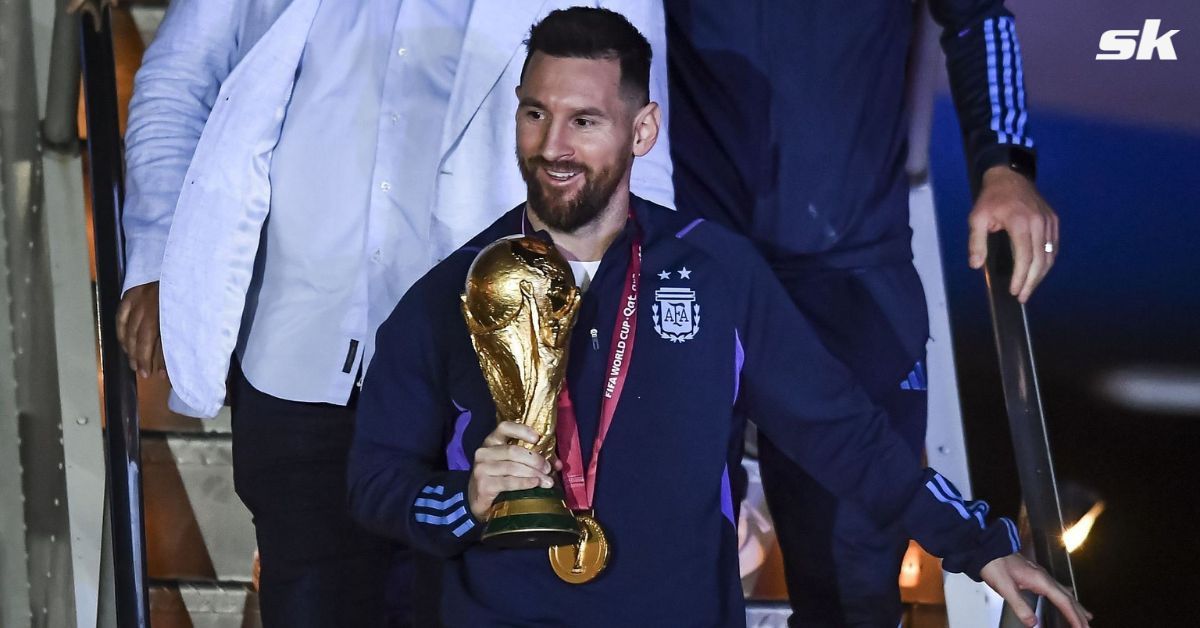 Lionel Messi with the FIFA World Cup trophy. 