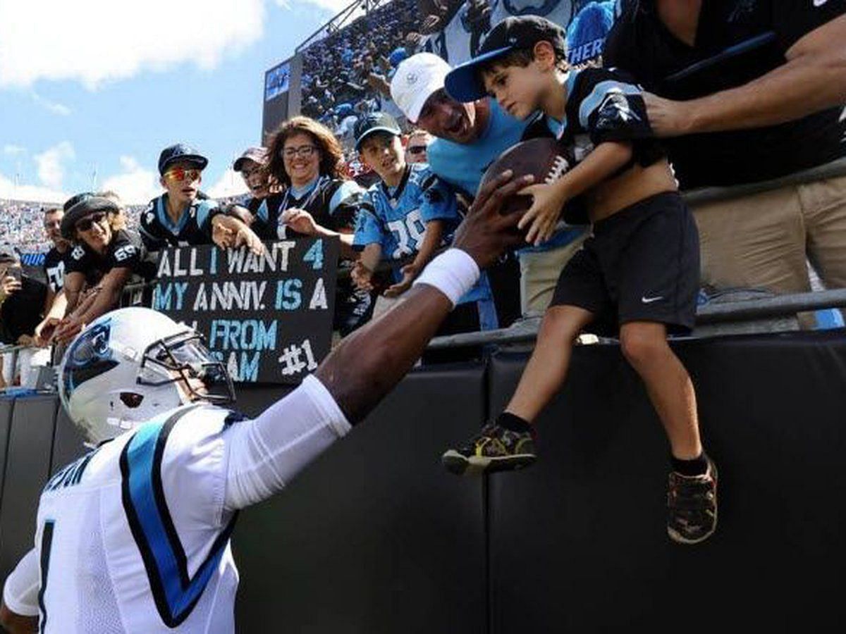 Do NFL players get fined for giving away footballs to the fans?