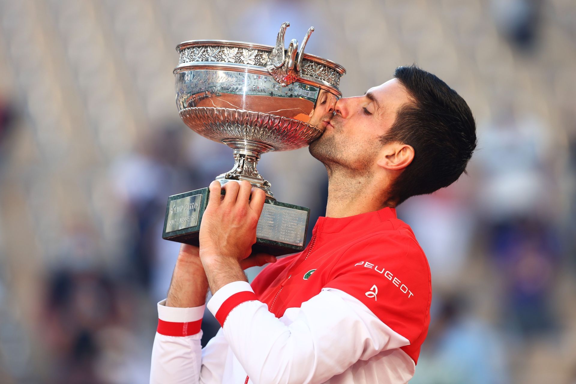 Novak Djokovic with the 2021 French Open trophy