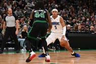 Orlando Magic forward Paolo Banchero (right) in action against the Boston Celtics