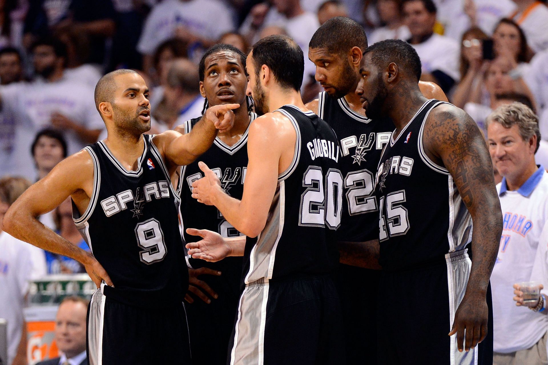 Tony Parker of the San Antonio Spurs talks with teammates Kawhi Leonard, Manu Ginobili, Tim Duncan and DeJuan Blair of the San Antonio Spurs