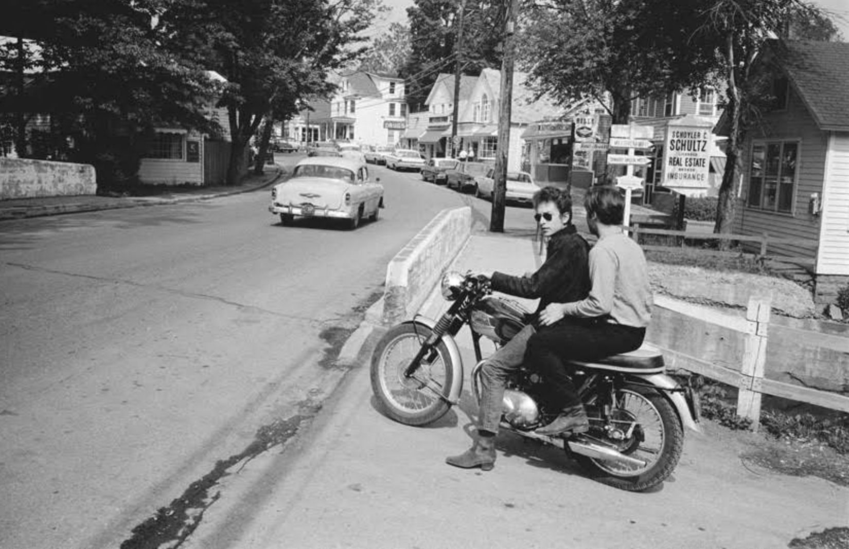 Bob Dylan and John Sebastian on a Triumph Motorcycle in Woodstock, 1964 (Image via johnbsebastian.com)