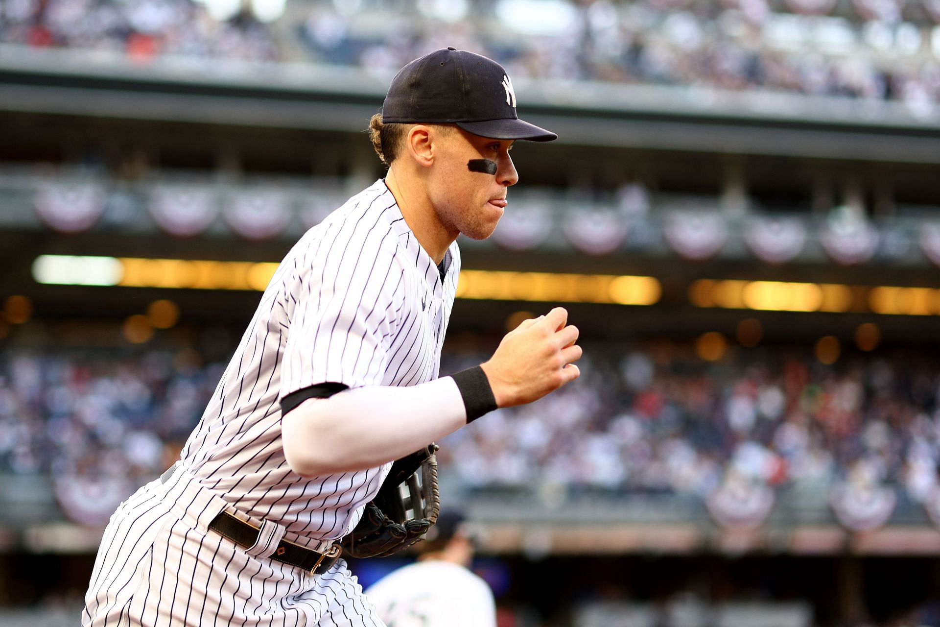 Aaron Judge runs onto the field prior to game three of the ALCS at Yankee Stadium