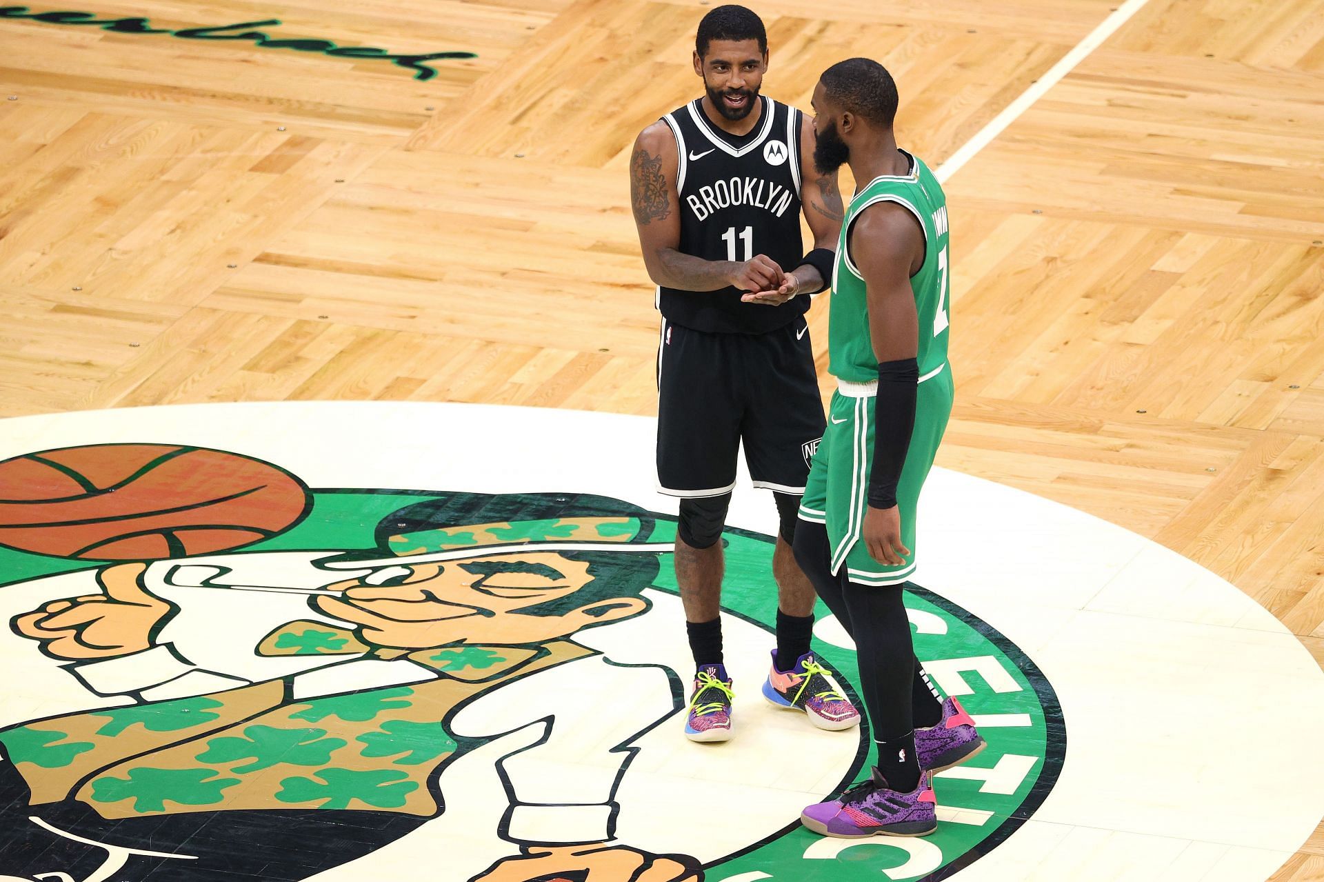 Jaylen Brown in conversation with Kyrie Irving
