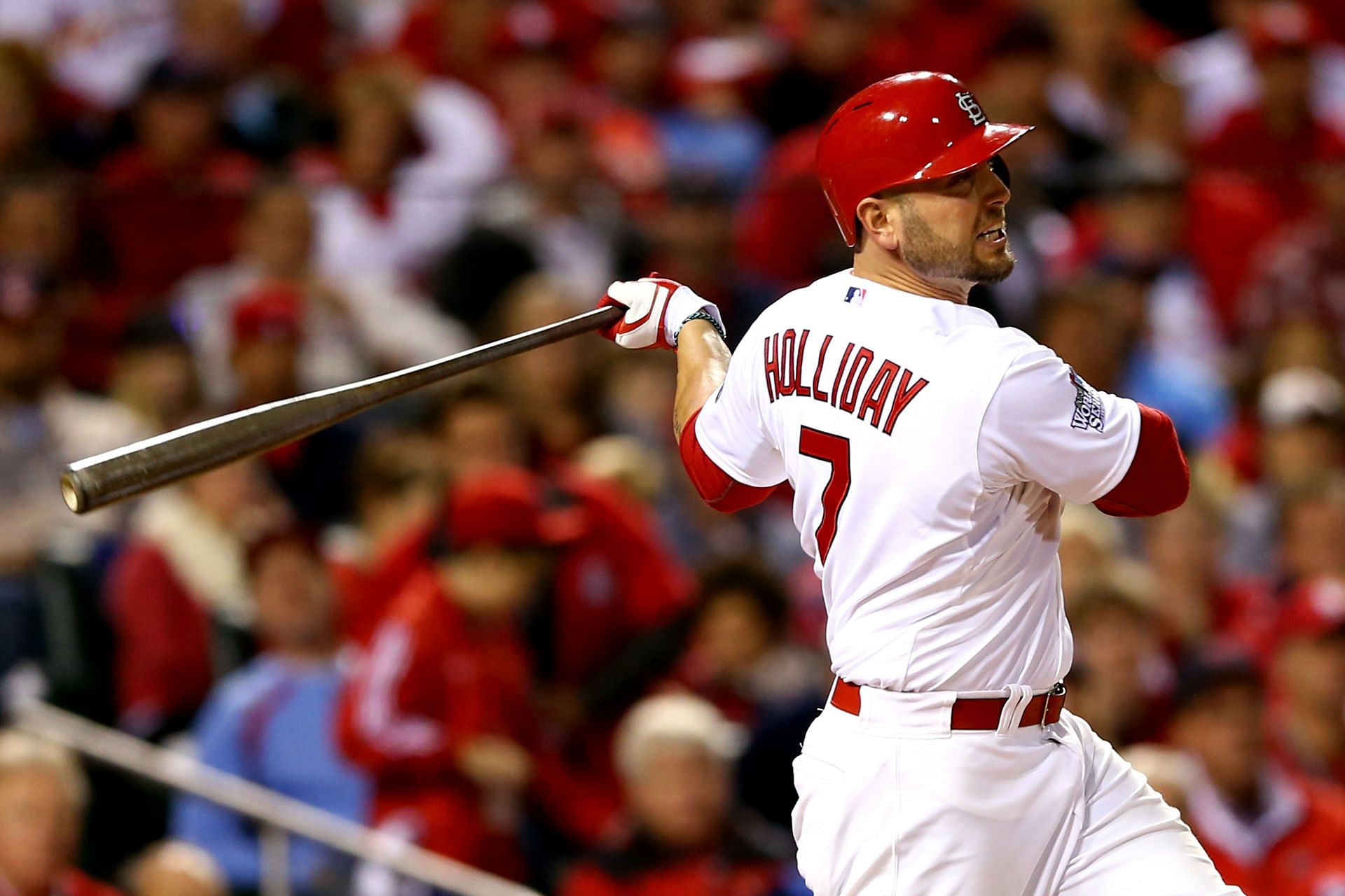 ST LOUIS, MO - OCTOBER 28: Matt Holliday #7 of the St. Louis Cardinals hits a solo home run in the fourth inning against the Boston Red Sox during Game Five of the 2013 World Series at Busch Stadium on October 28, 2013 in St Louis, Missouri. (Photo by Elsa/Getty Images)