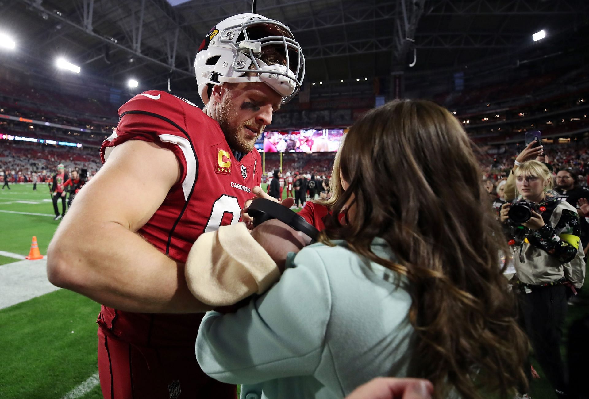 Arizona Cardinals DE JJ with wife Kealia and son Koa at the Buccaneers vs. Cardinals game