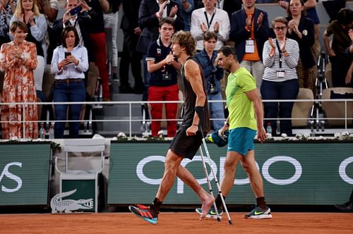 Alexander Zverev [in black] in crutches after retiring midway against Nadal at the 2022 French Open