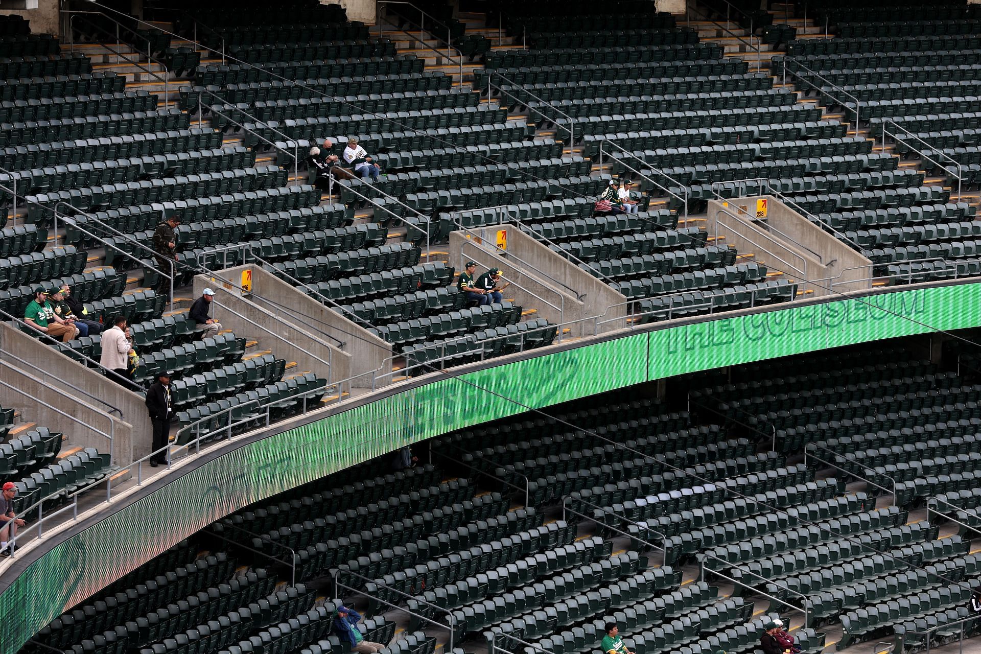 Rows of seats sit empty as the Oakland Athletics play the Texas Rangers at RingCentral Coliseum